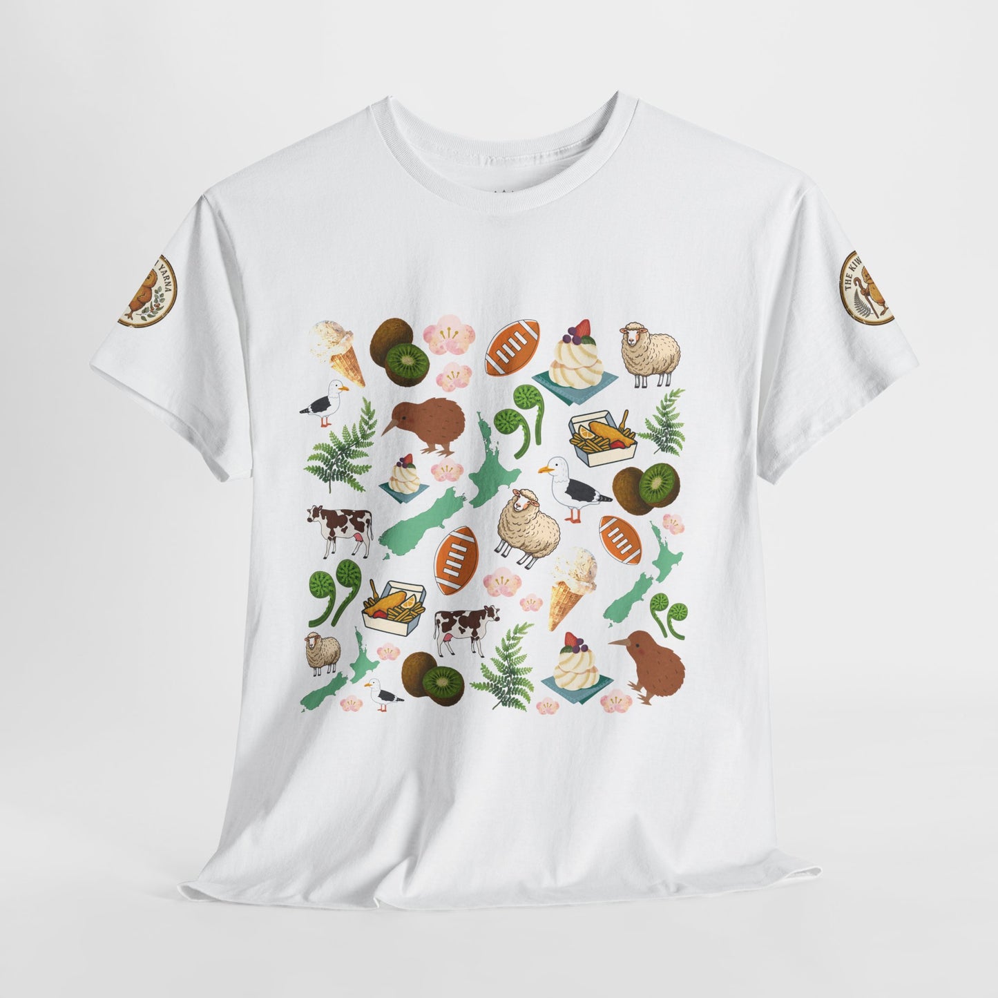 Kiwiana-themed T-shirt in white with scattered animal, fruit, and fern illustrations