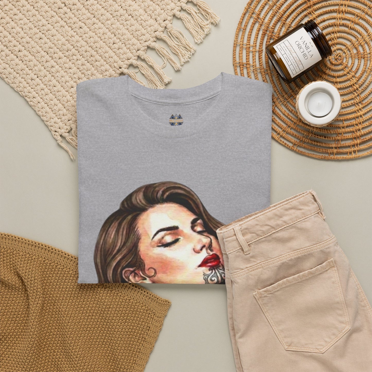 Heather gray T-shirt with woman portrait print, styled with beige pants