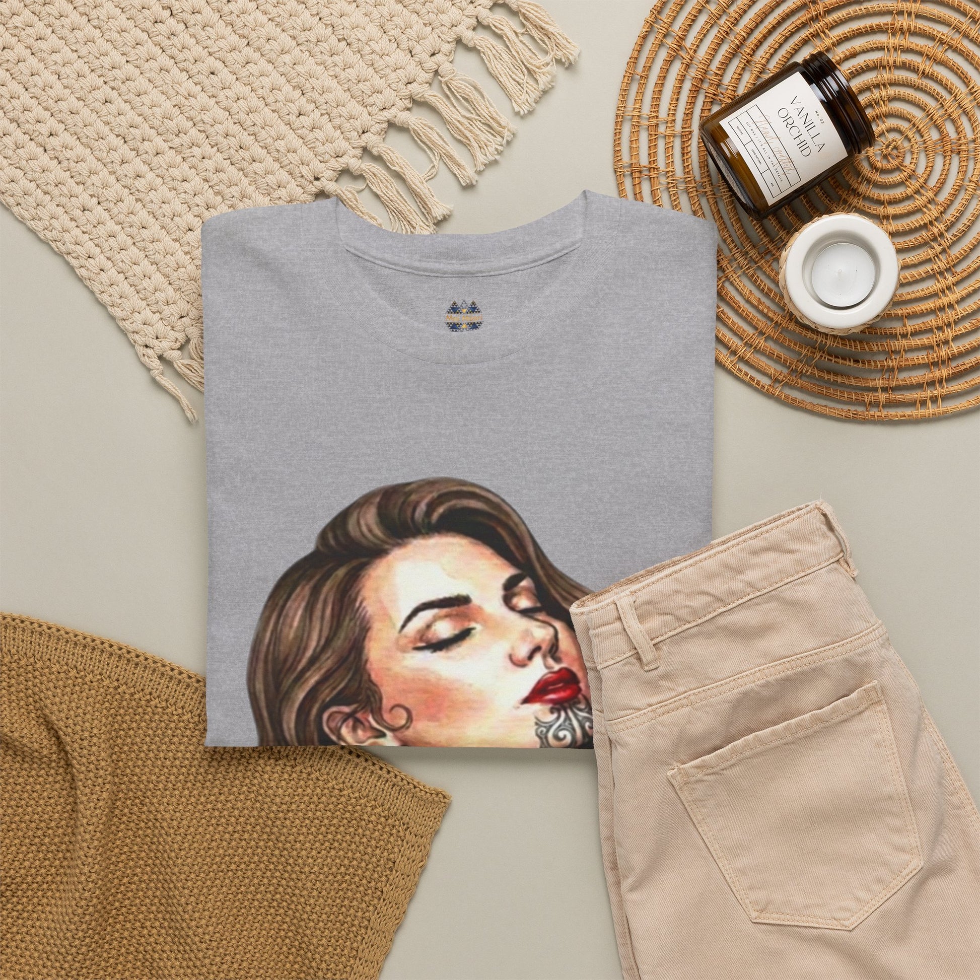 Heather gray T-shirt with woman portrait print, styled with beige pants
