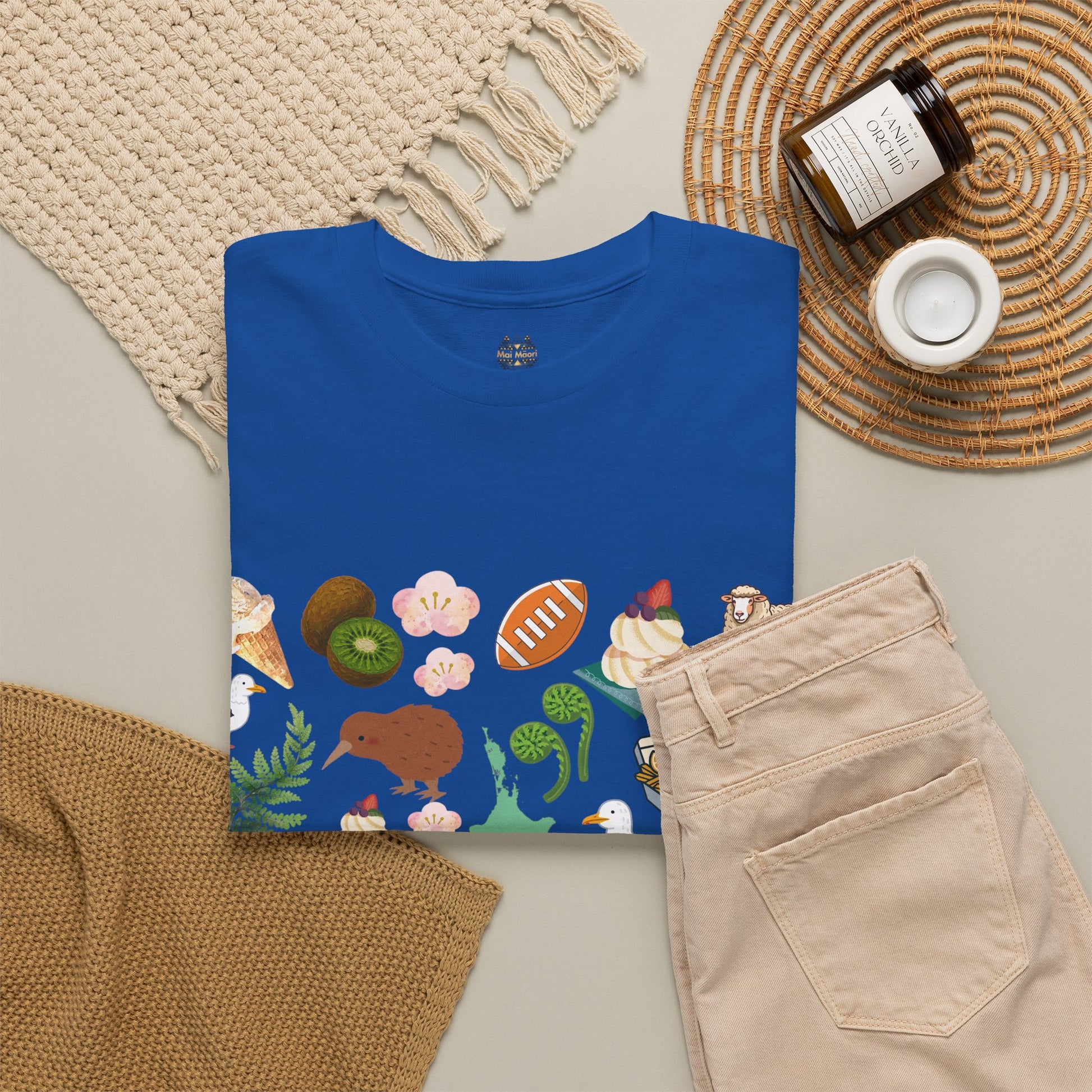 Kiwiana graphic T-shirt flat lay in antique sapphire blue, crew neck with wildlife art front