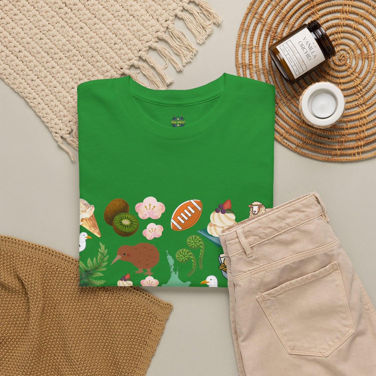 Green T-shirt with small collar logo and colorful tropical print along the front