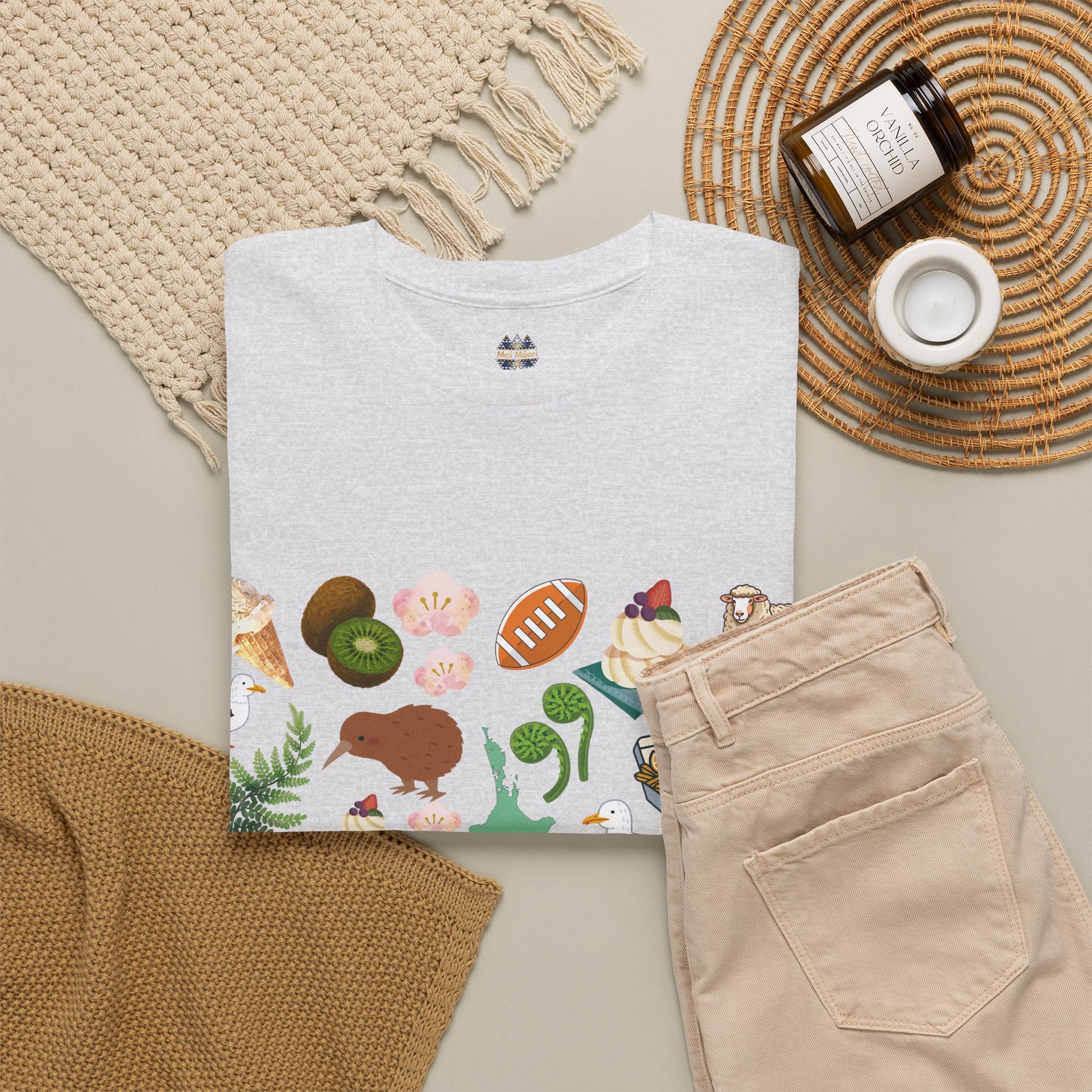 White short-sleeve T-shirt with small chest emblem and colorful animal print