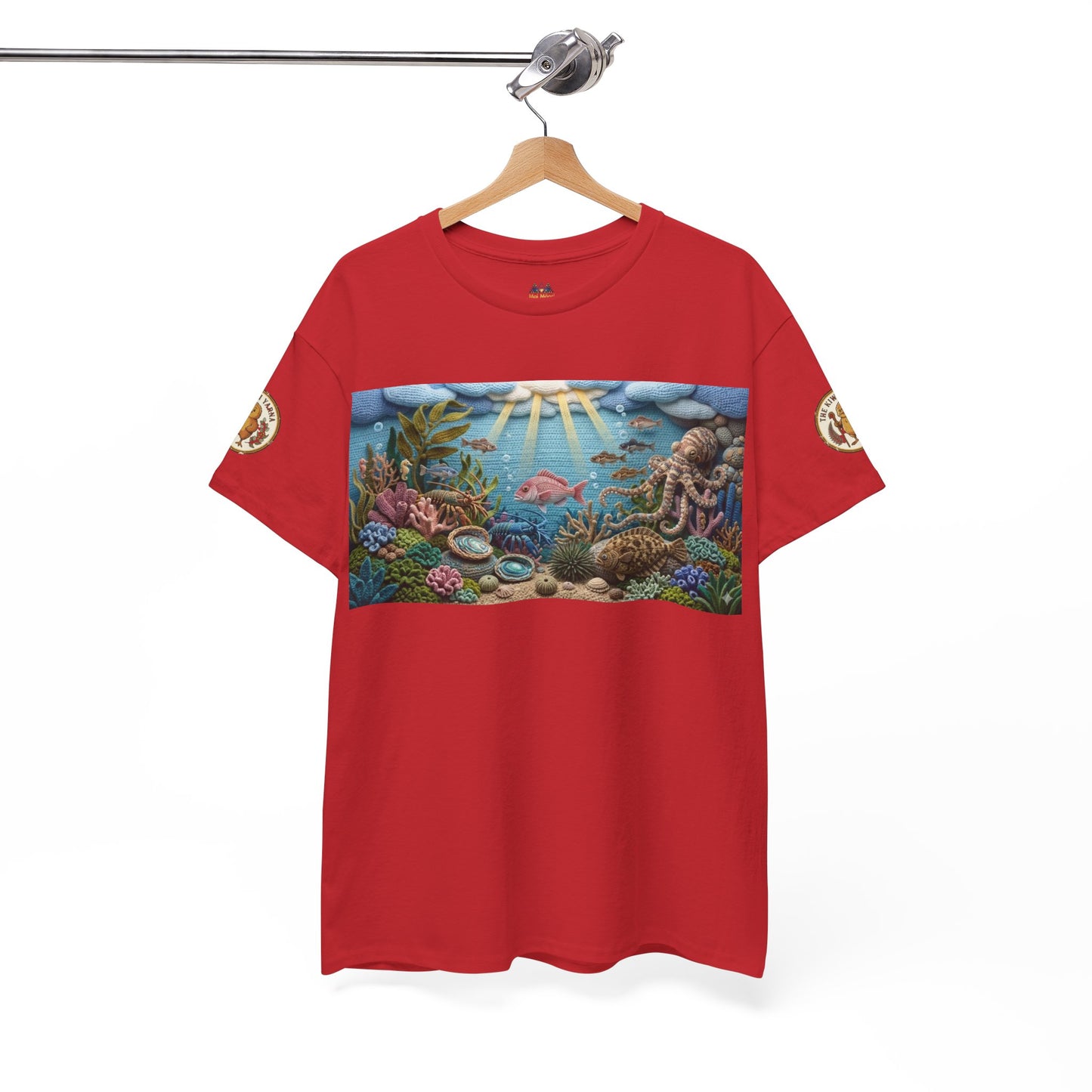 Red crewneck T-shirt hanging on hanger with ocean scene chest graphic