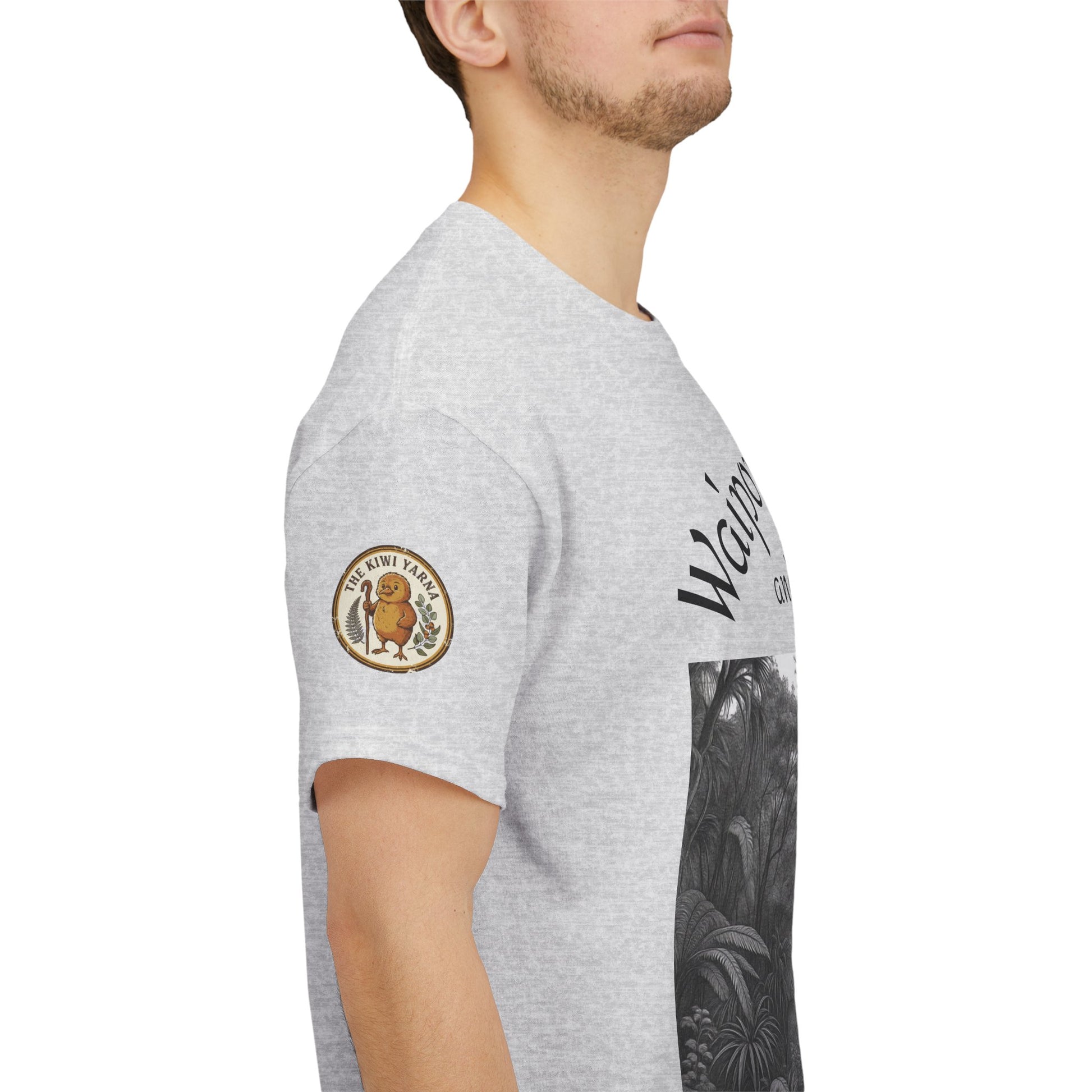 Heather gray T-shirt sleeve with round logo patch and partial forest graphic