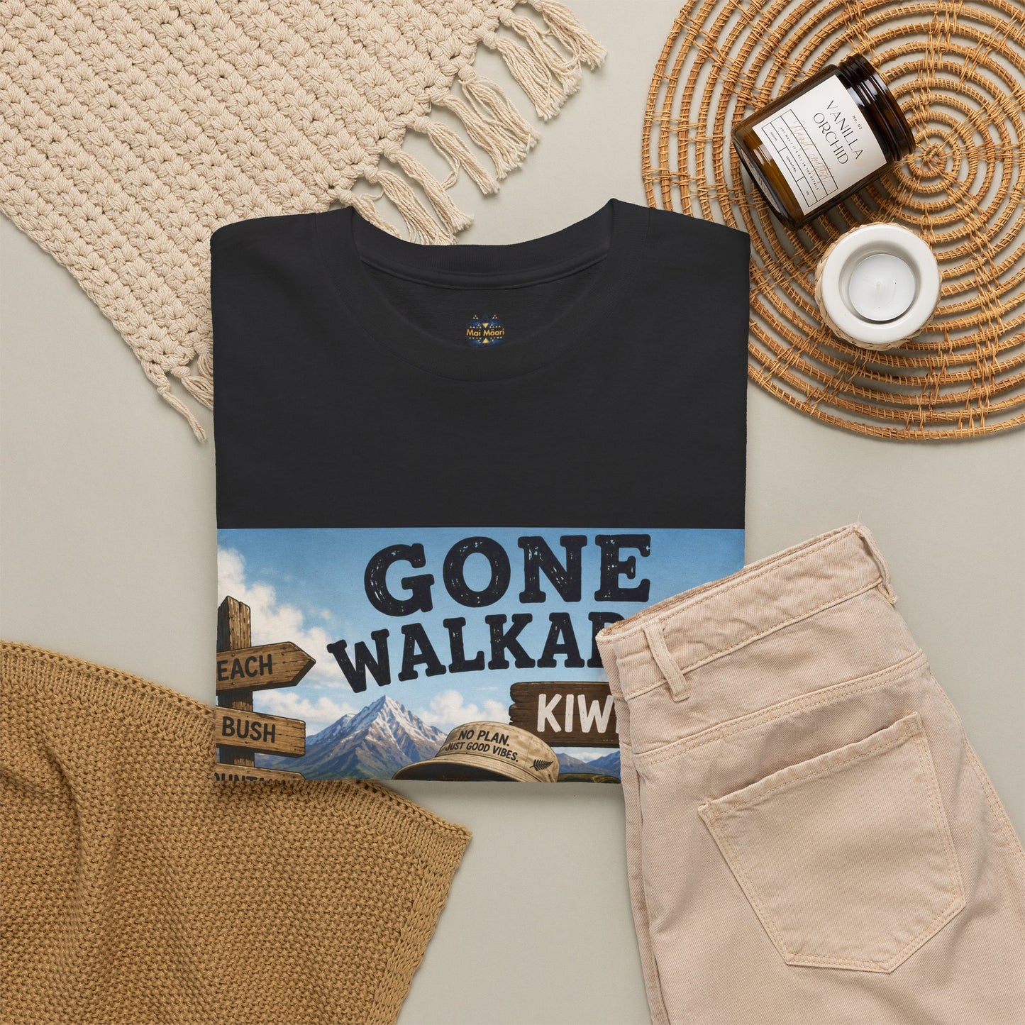 Black graphic T-shirt top view with wide Gone Walkabout Kiwi Style poster print