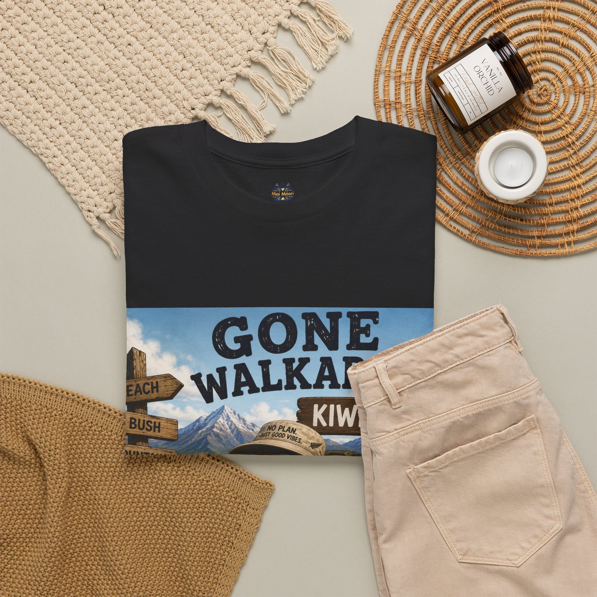 Black graphic T-shirt top view with wide Gone Walkabout Kiwi Style poster print