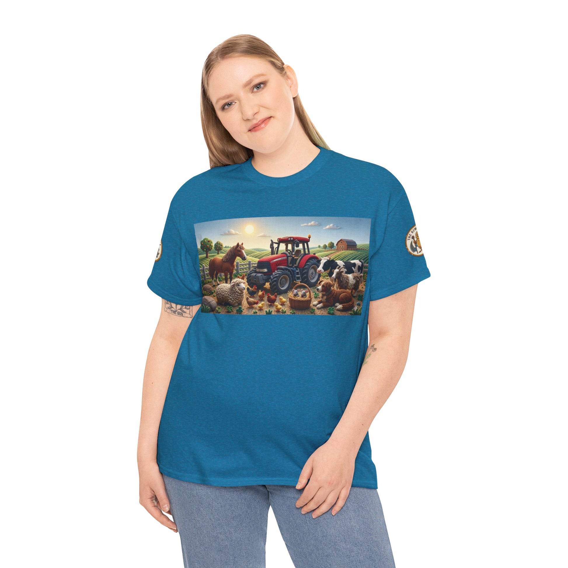 Teal crewneck T-shirt with front farm tractor and animals graphic, worn by model.
