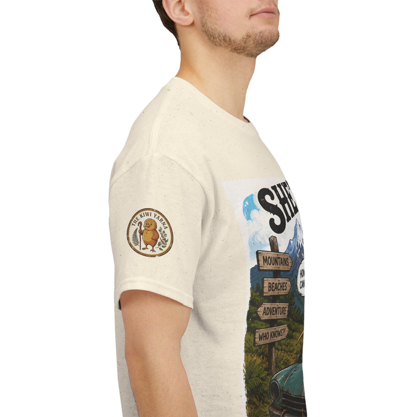 Light beige graphic T-shirt on model, with sleeve patch and side view print.