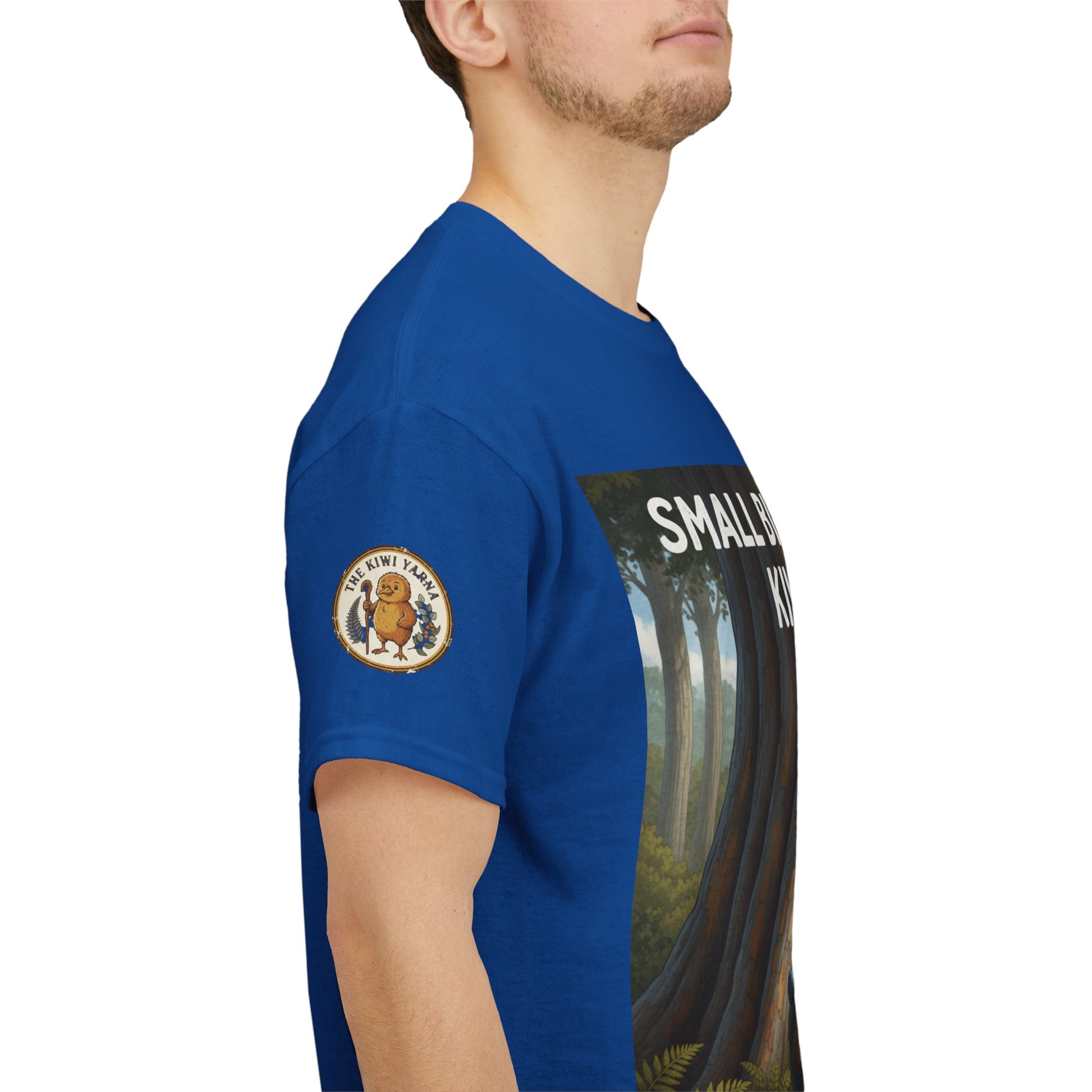 Blue T-shirt sleeve with round logo patch; side view.