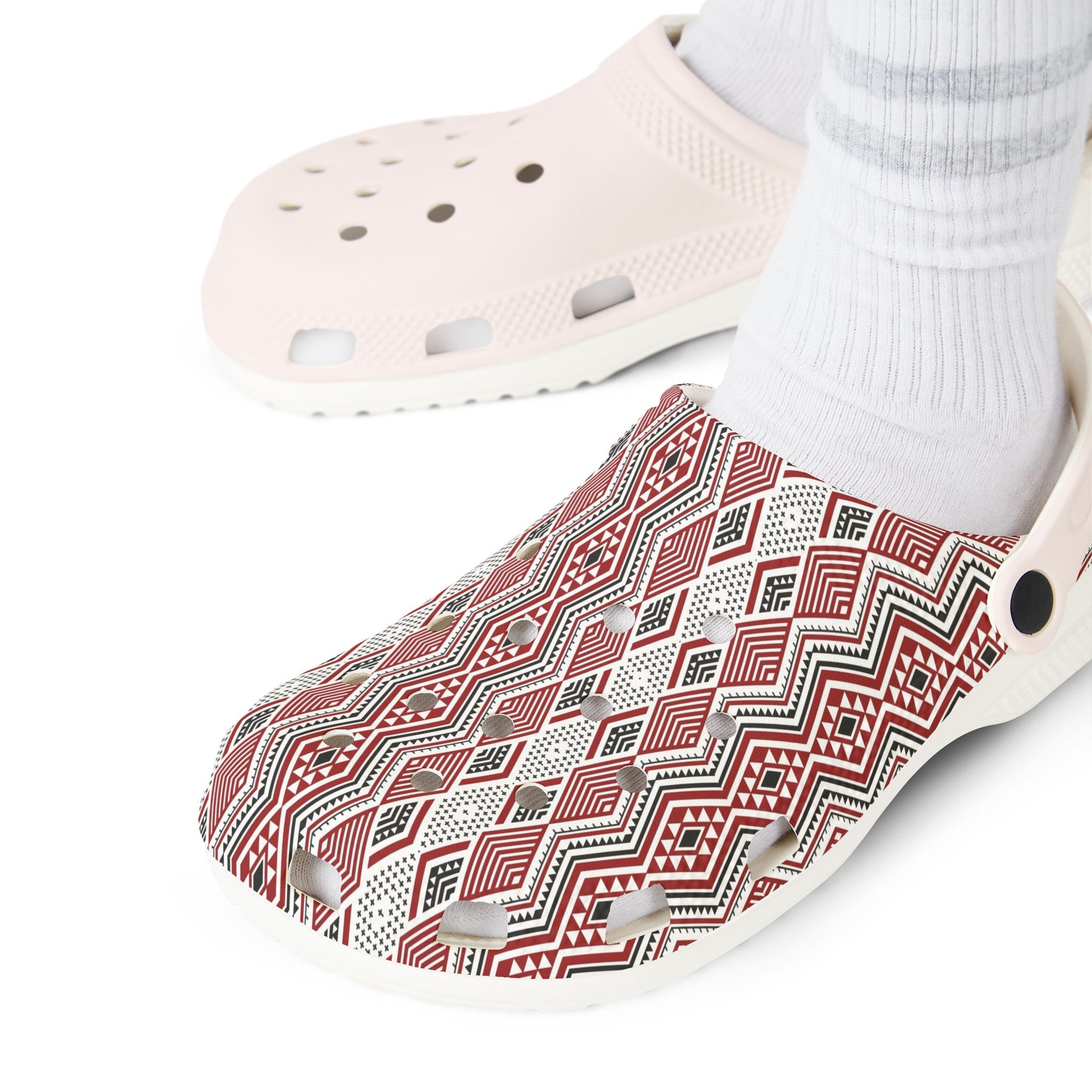 Tāniko patterned clog upper with perforations, gray slot detail, and red geometric design