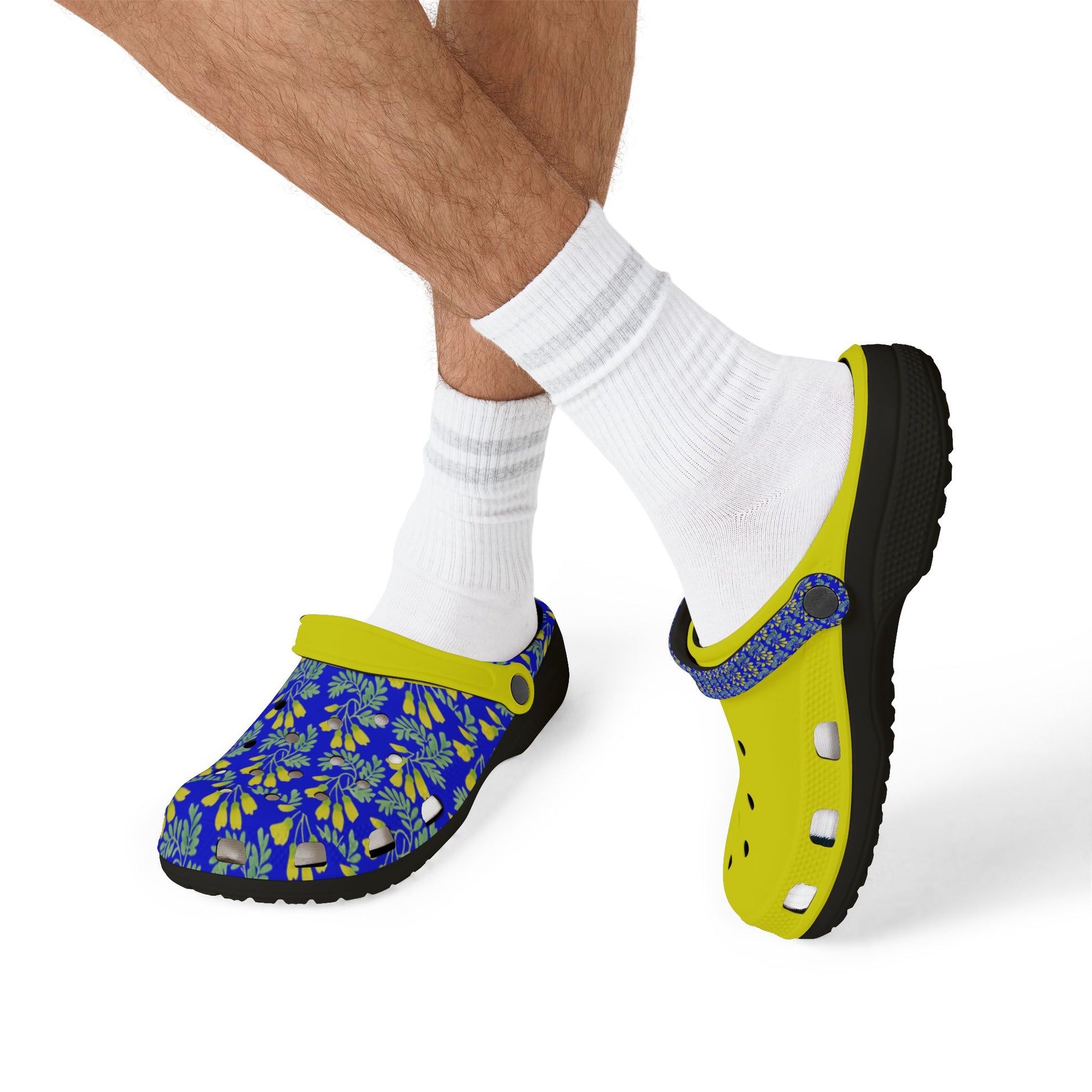 Blue floral slip-on clog and neon yellow clog worn with white socks.