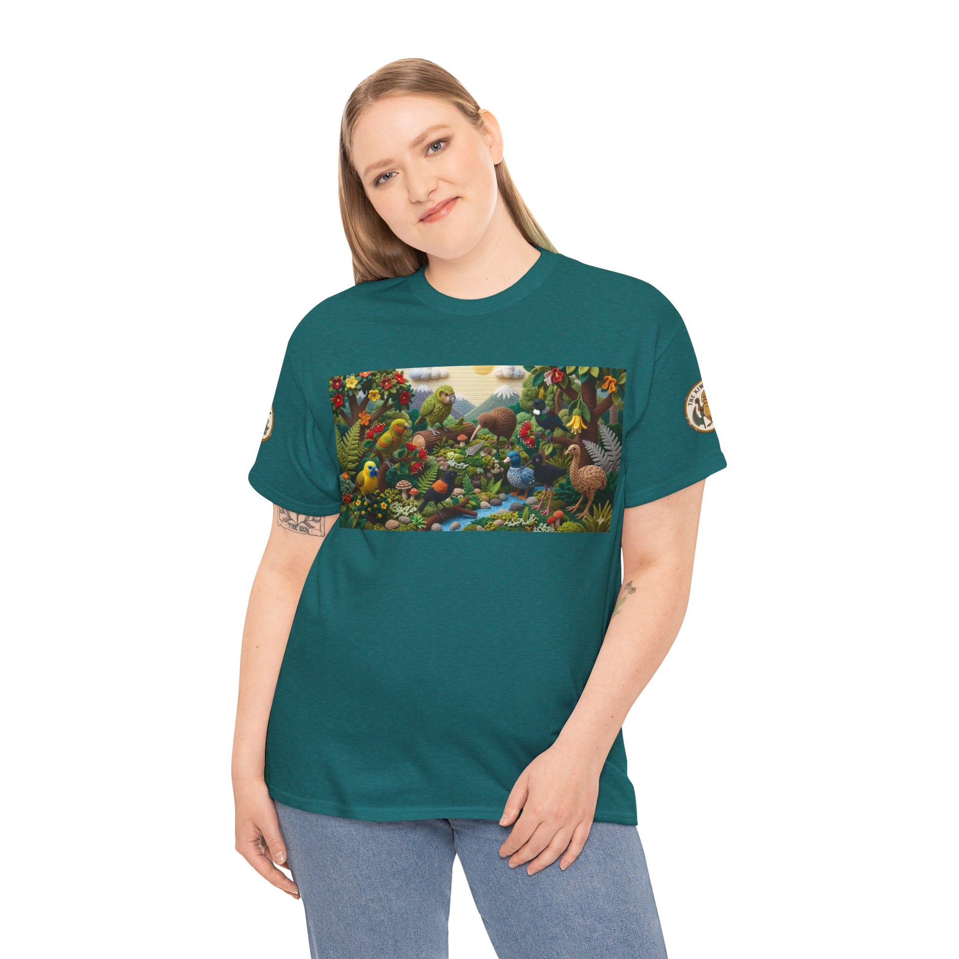 Teal bird-graphic T-shirt worn by model, crew neck and short sleeves visible.