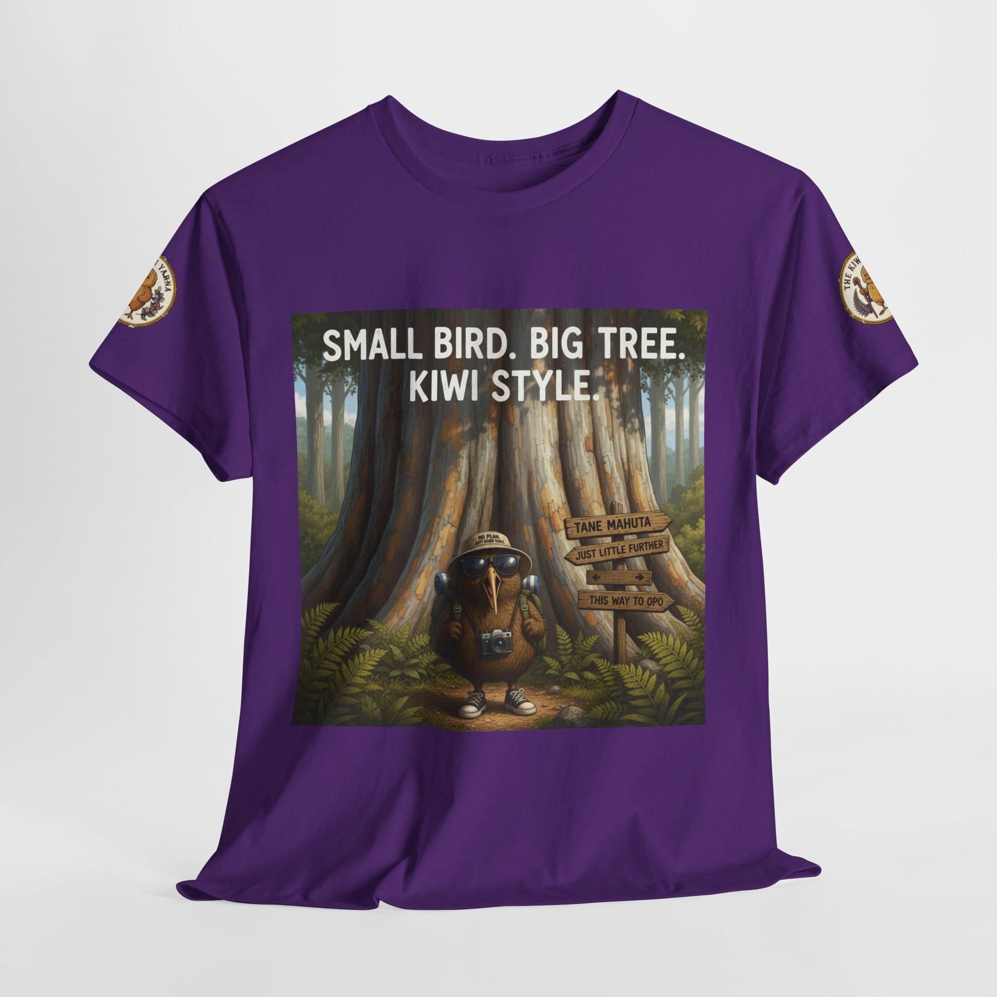 Purple graphic t-shirt front view with framed tree and kiwi-style artwork