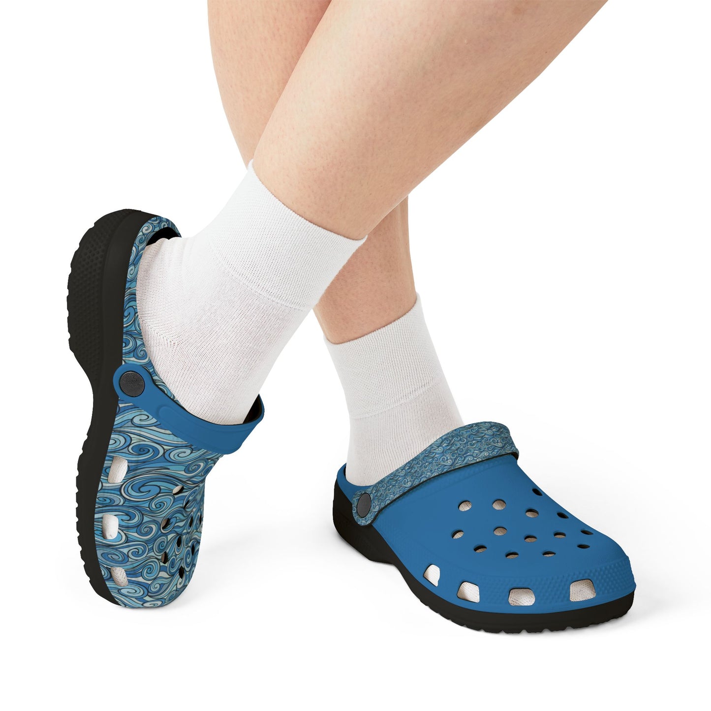 Blue patterned clog sandals worn with white socks, side view on dark outsole
