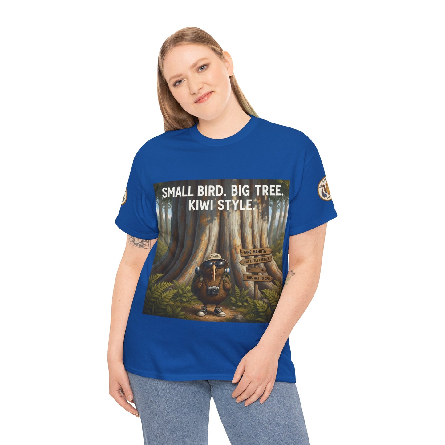 Blue crew-neck T-shirt worn by model, front print with bird and forest tree art.