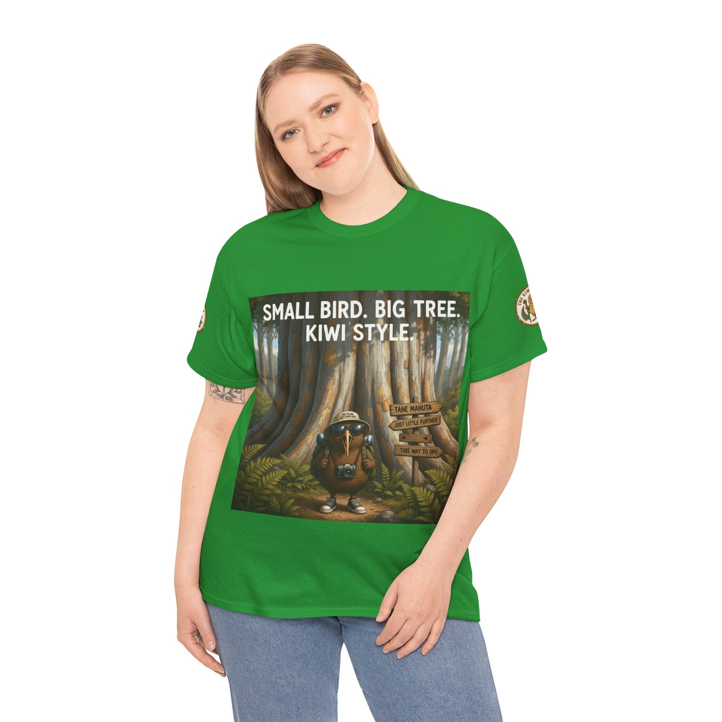 Green graphic T-shirt with front woodland scene and “Kiwi Style” text
