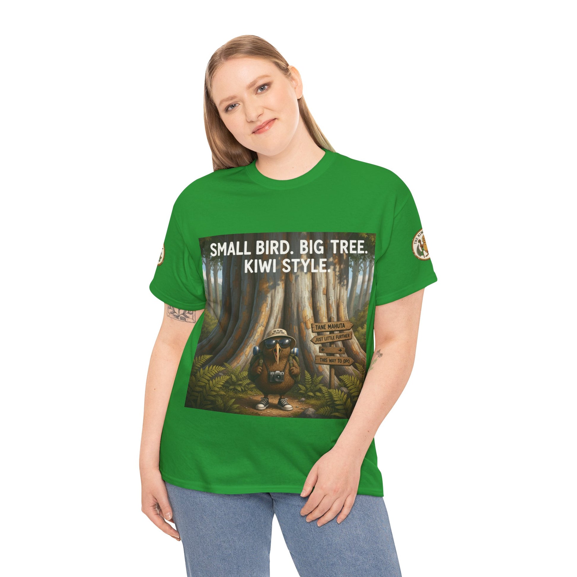 Green graphic T-shirt with front woodland scene and “Kiwi Style” text