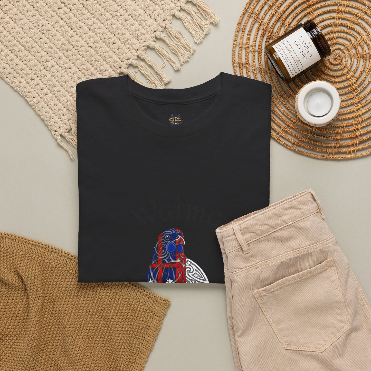 Black graphic T-shirt with small bird-and-leaves design and crew neck emblem