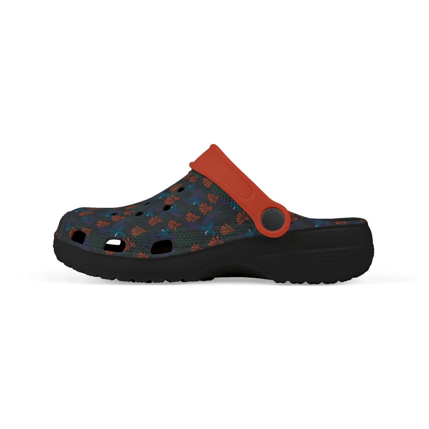 Kids' clog-style casual shoe, angled side view, dark blue patterned upper with orange strap