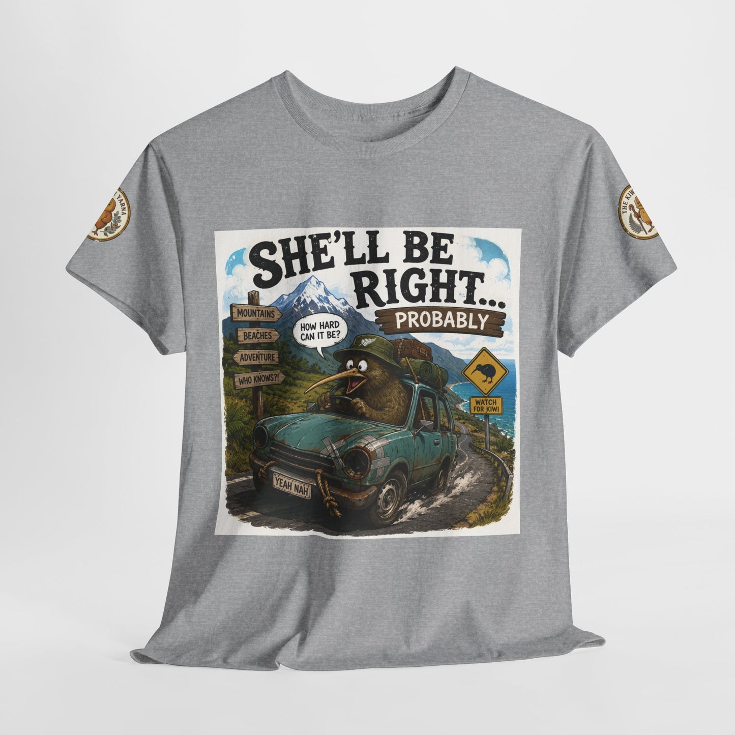 Grey T-shirt on hanger with centered “She’ll Be Right… Probably” graphic and sleeve patches