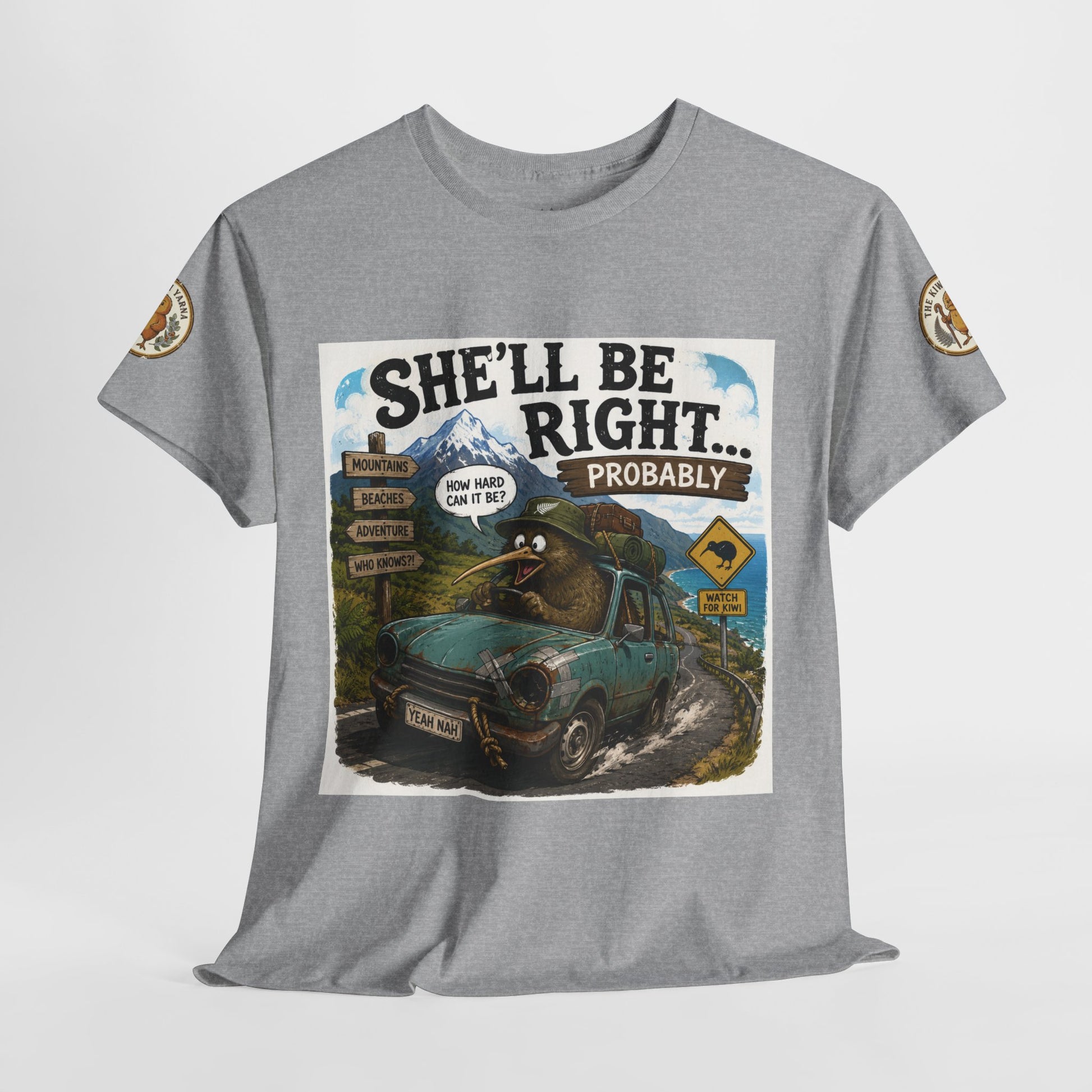 Grey T-shirt on hanger with centered “She’ll Be Right… Probably” graphic and sleeve patches