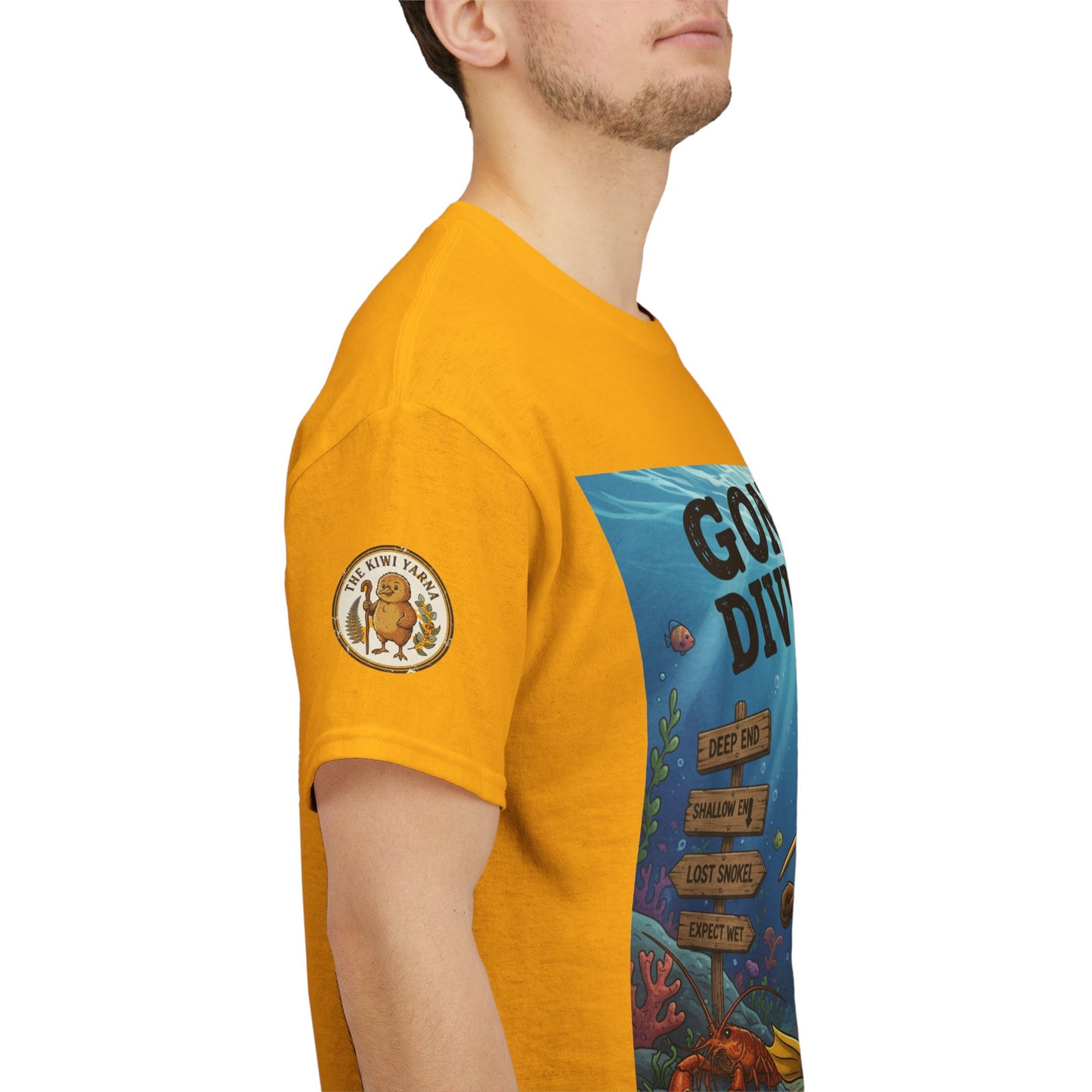 Yellow kids graphic T-shirt on model, side view with sleeve emblem and diver print