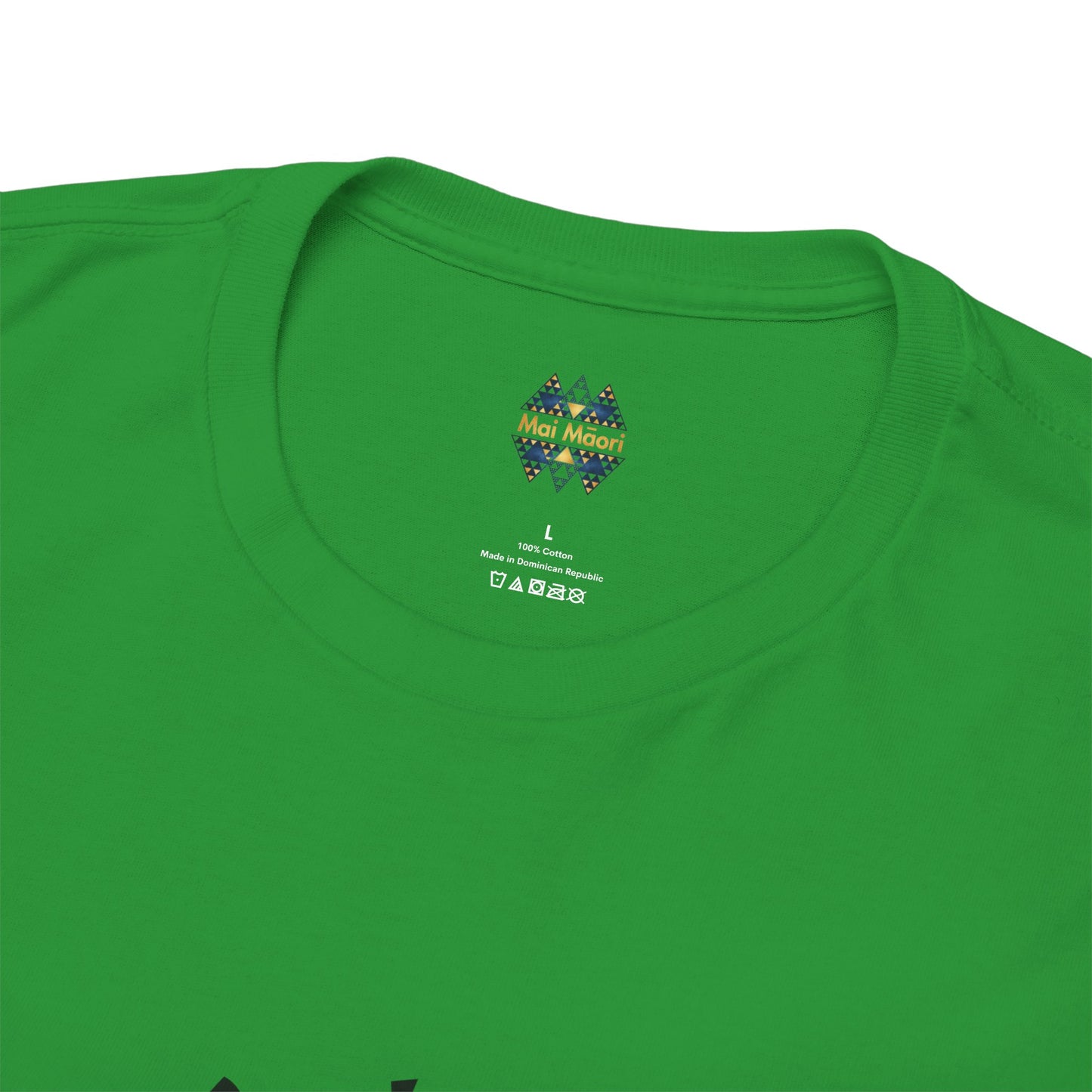 Green T-shirt close-up of back collar with small colorful emblem logo