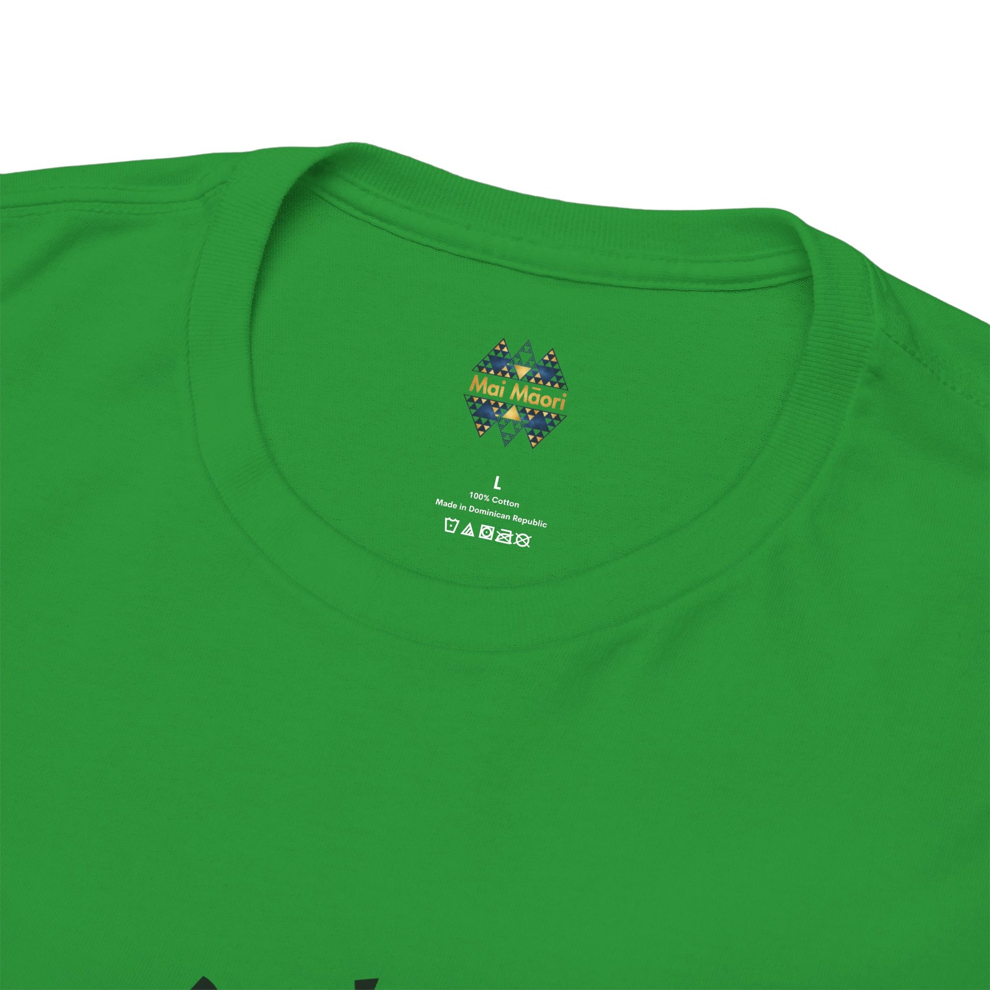 Green T-shirt close-up of back collar with small colorful emblem logo