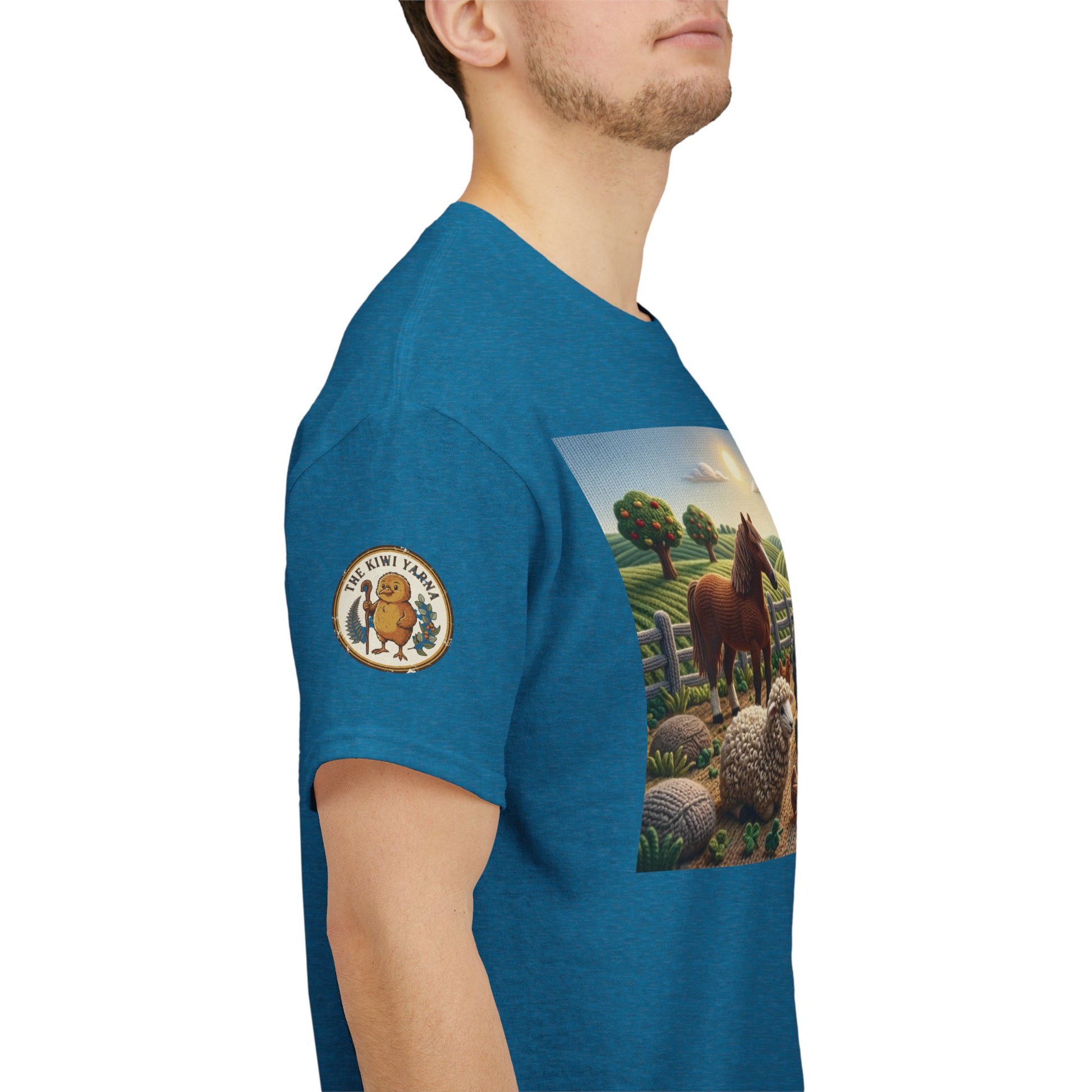 Blue short-sleeve T-shirt with farm scene graphic and round logo patch on sleeve.