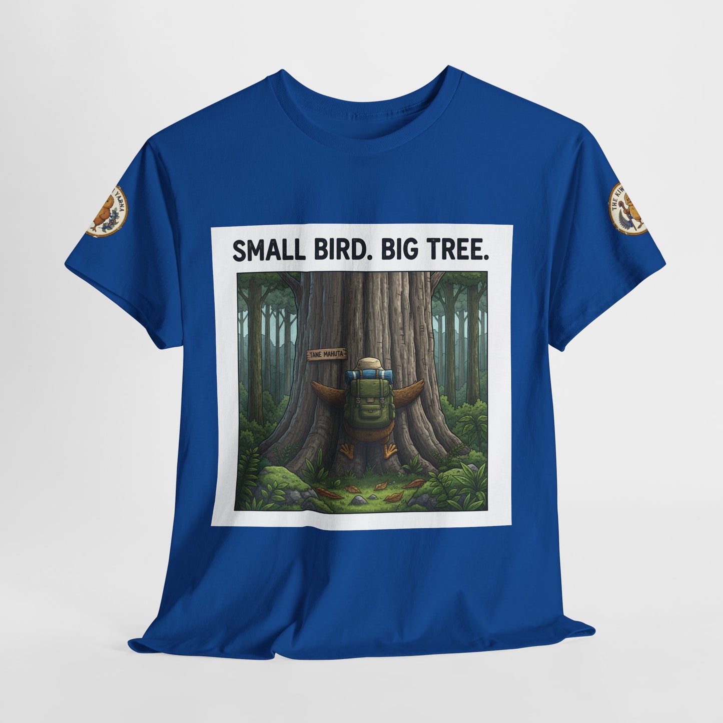 Blue crew-neck T-shirt with centered “Small Bird. Big Tree.” framed forest graphic