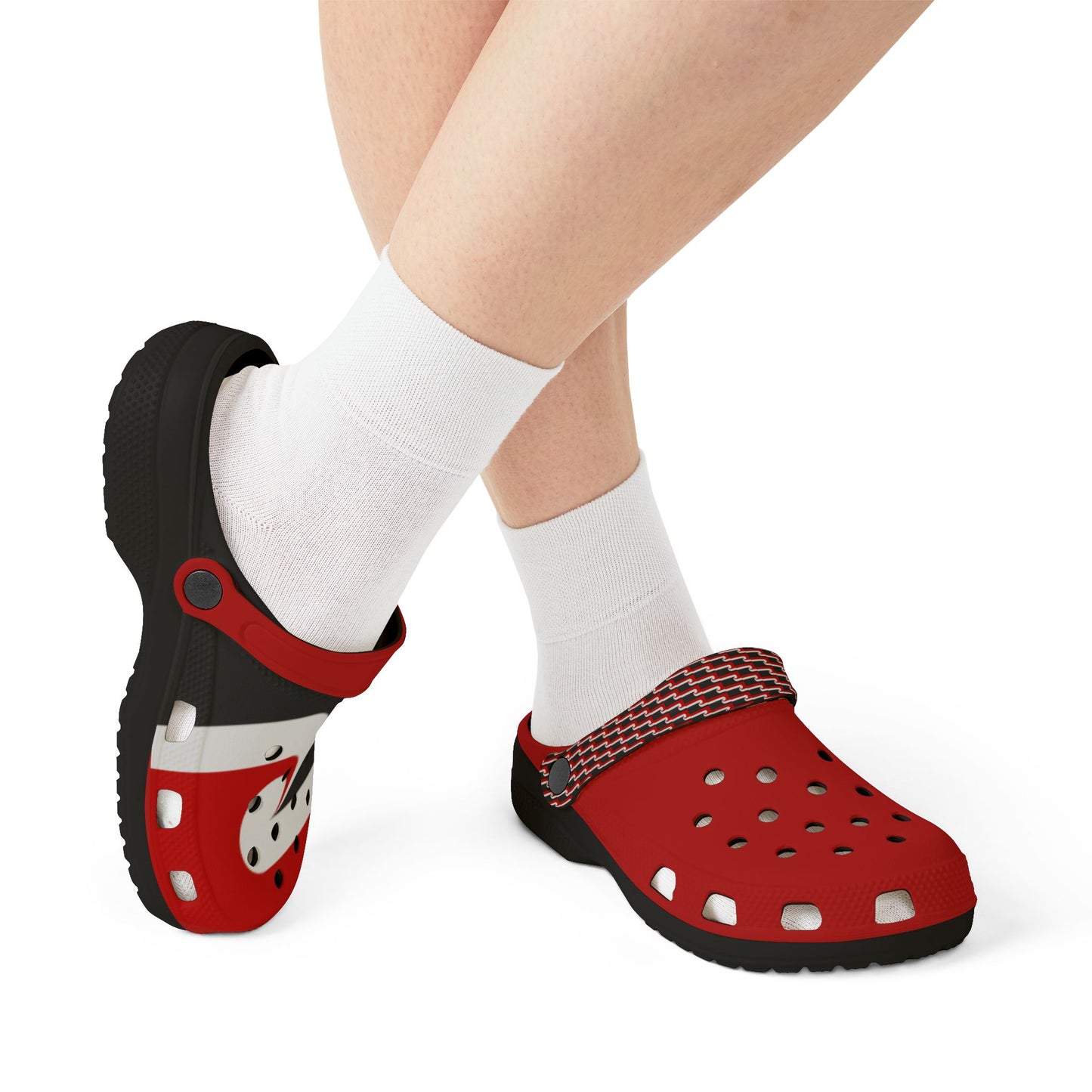 Red and black clogs with striped strap, worn with white socks