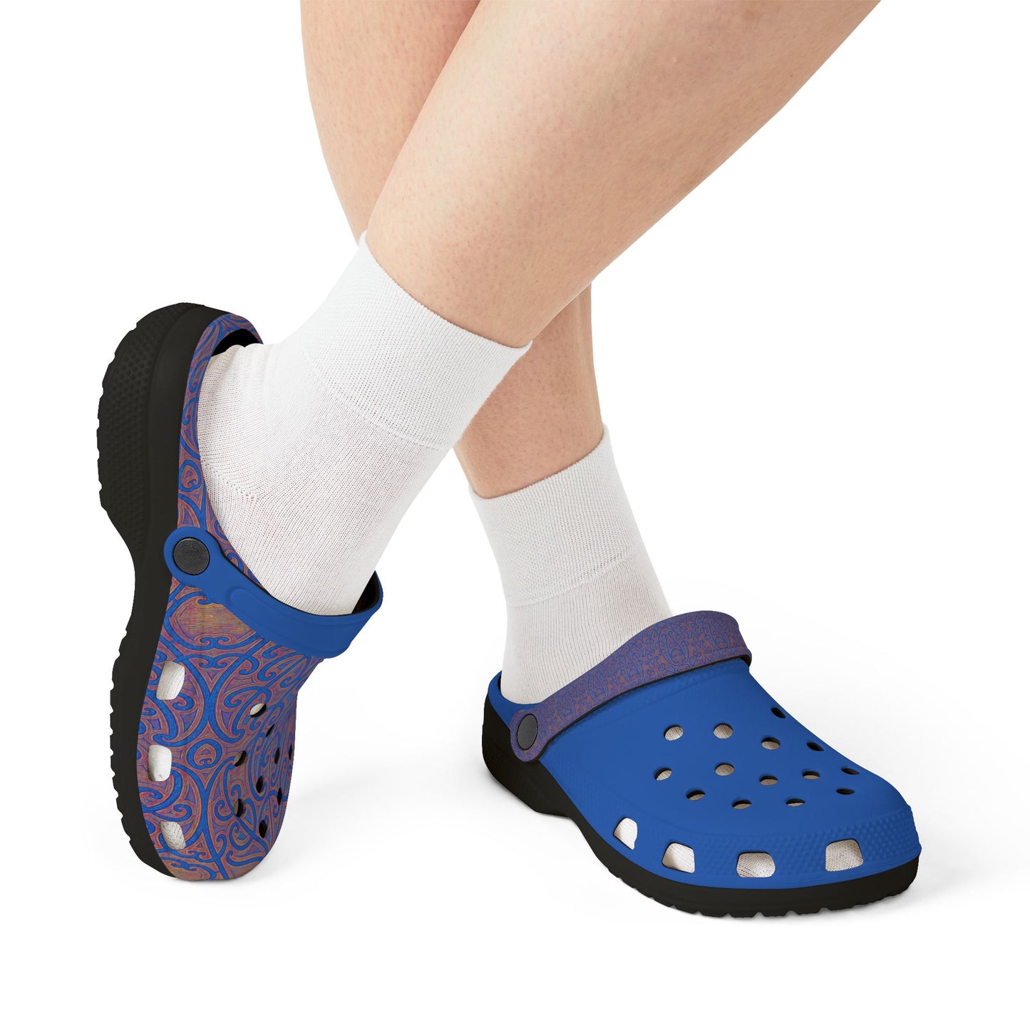 Blue and purple patterned croc-style clogs with vent holes, worn with white socks.