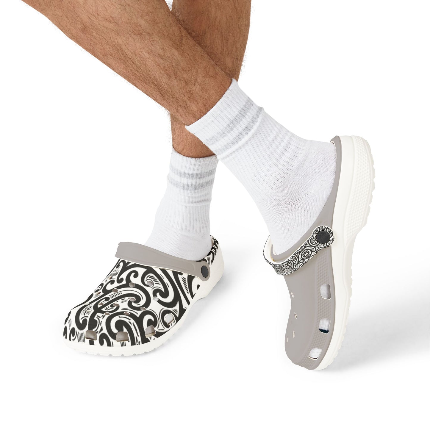 Ponga clogs on white socks, gray base with black-and-white paisley upper and strap