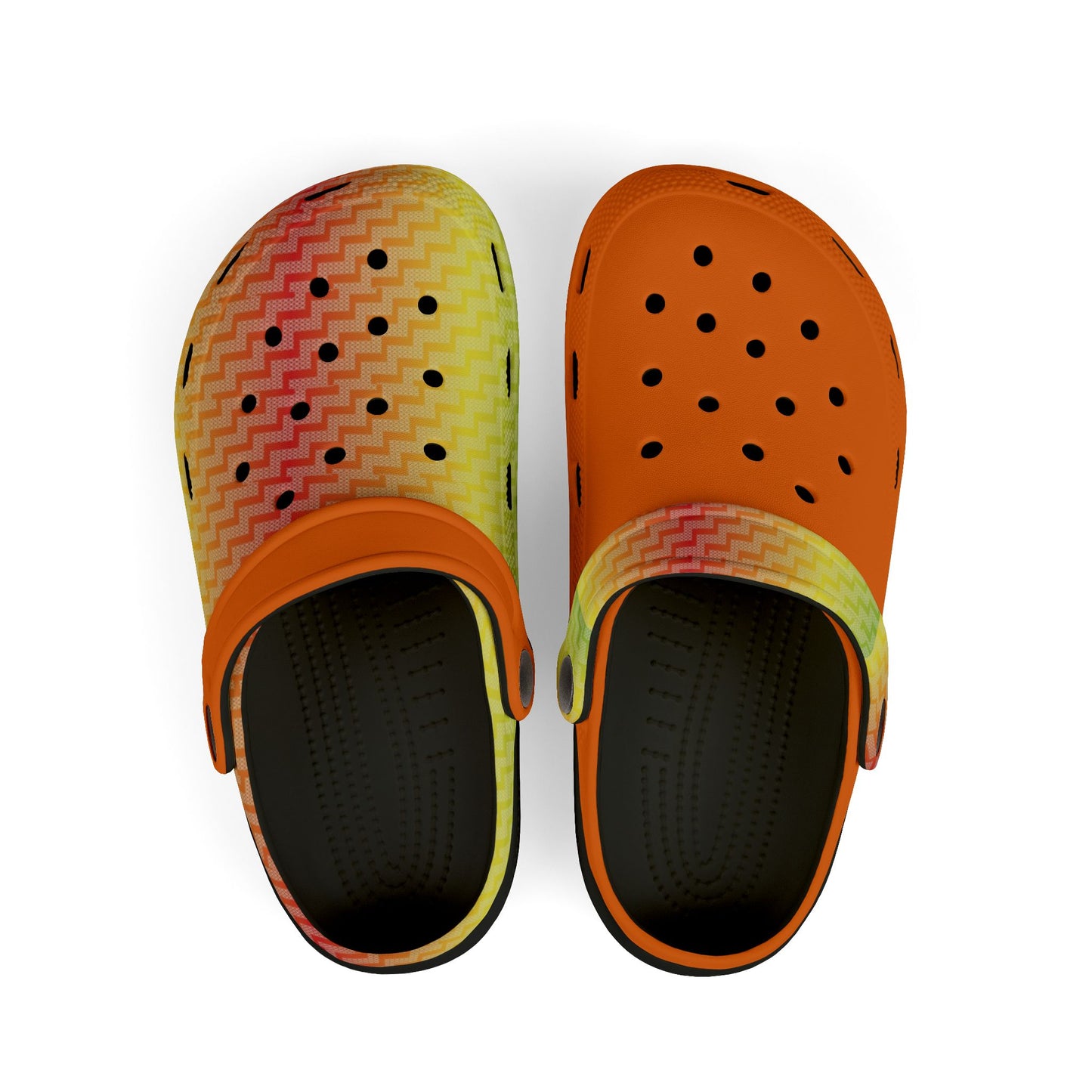 Pair of croc-style clogs with multicolor zigzag uppers and dark perforated interiors
