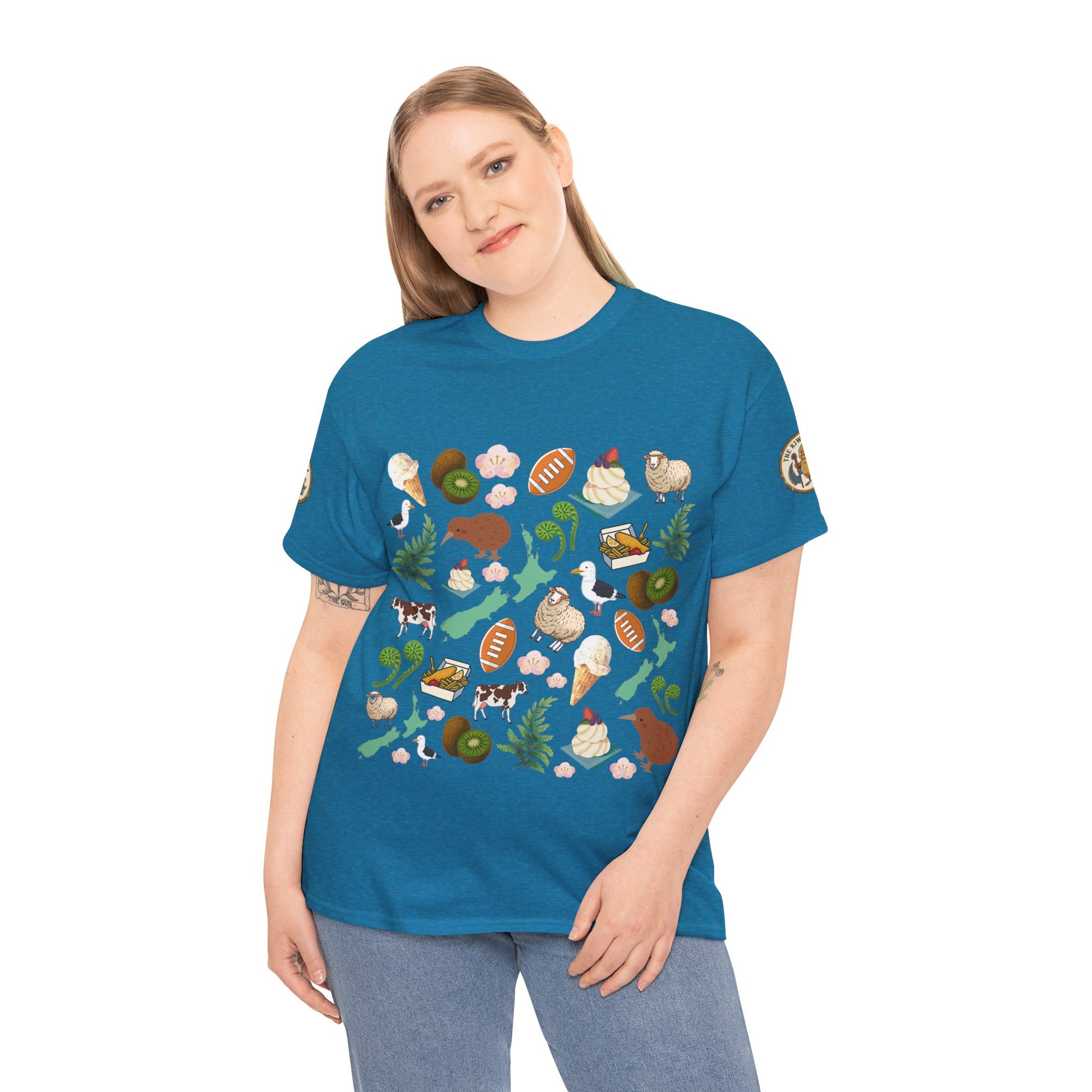 Teal graphic T-shirt on model with colorful wildlife collage print