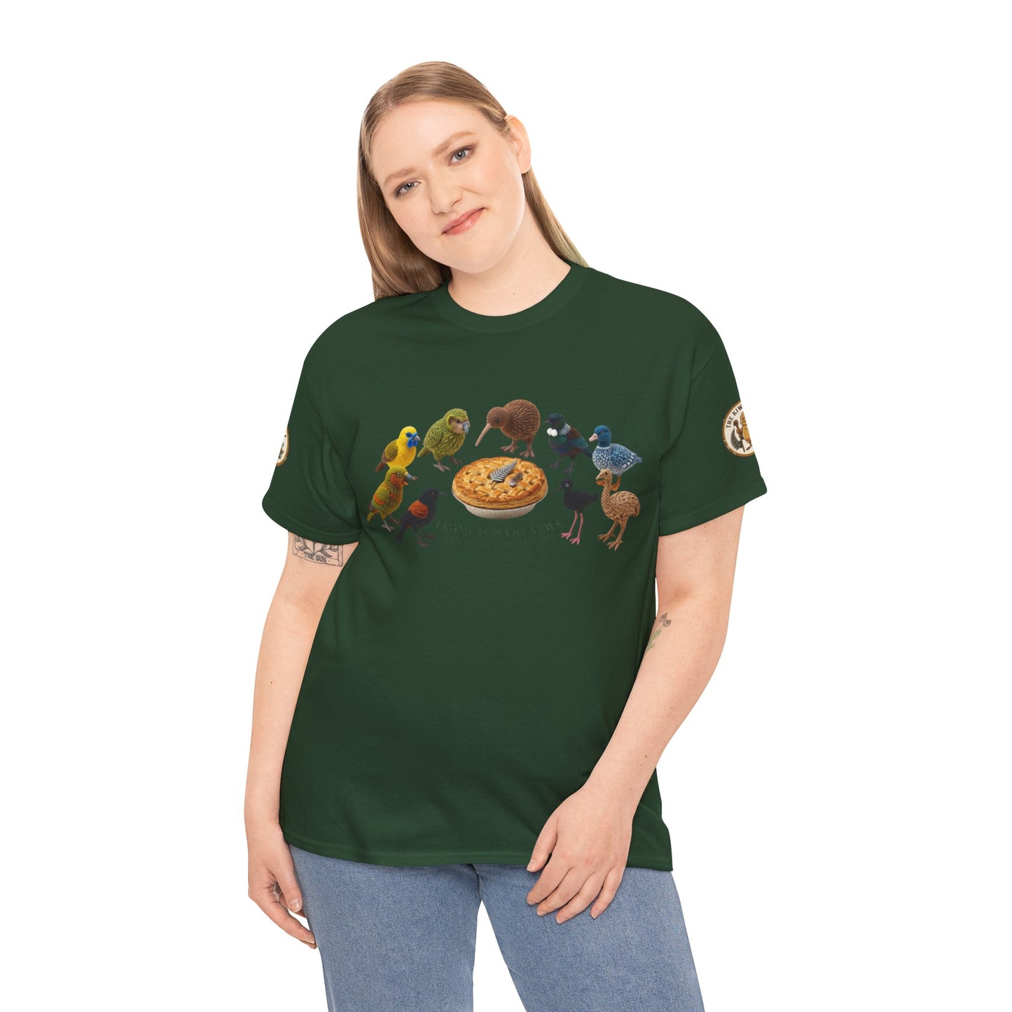 Dark green T-shirt worn by model, featuring birds and pie graphic across chest