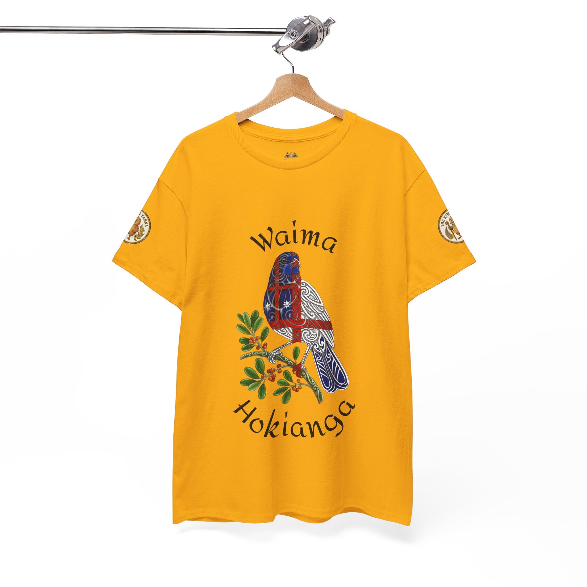 Gold graphic T-shirt with bird print and Waima Hokianga text