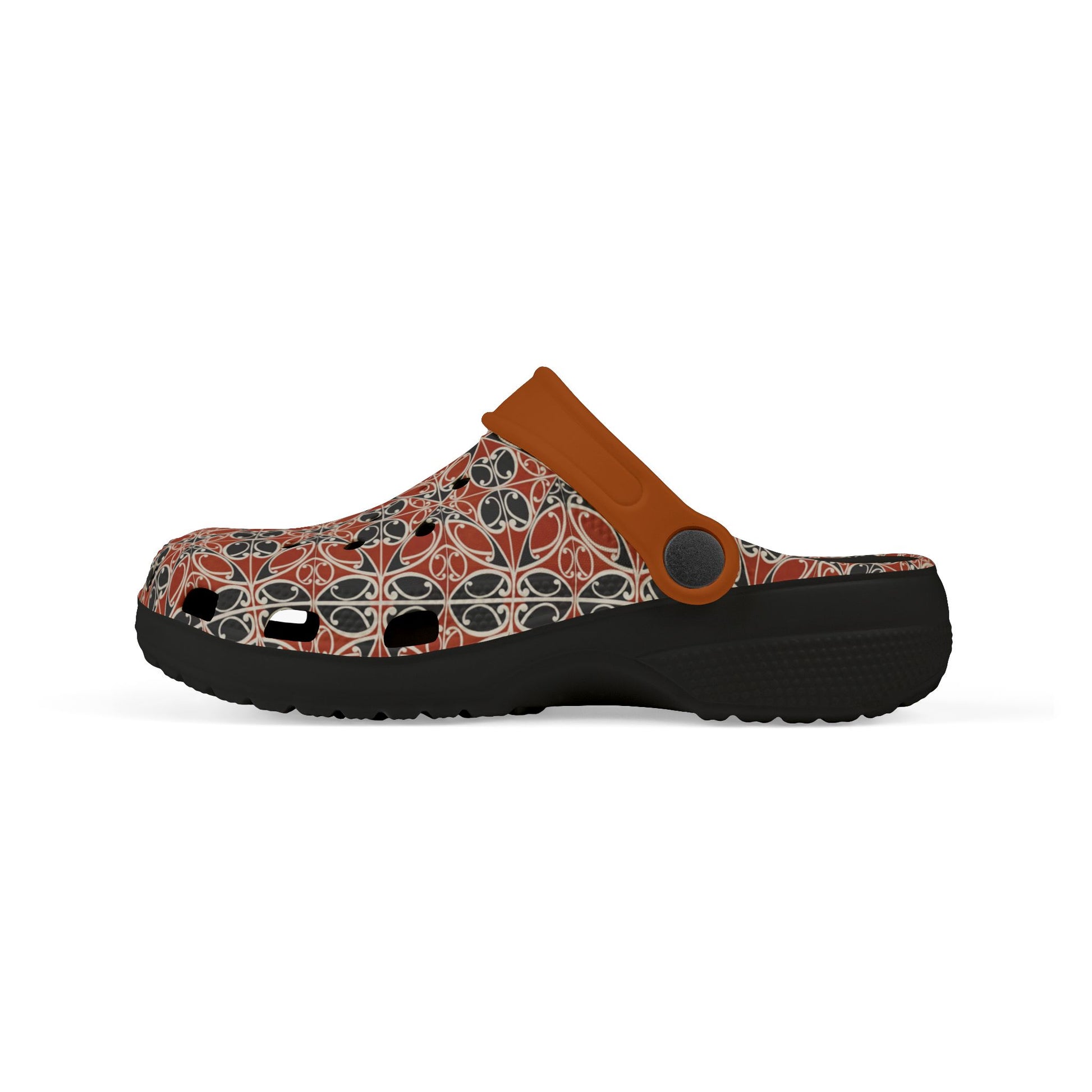 Māoritanga slide clogs profile with patterned upper, tan strap, and black outsole