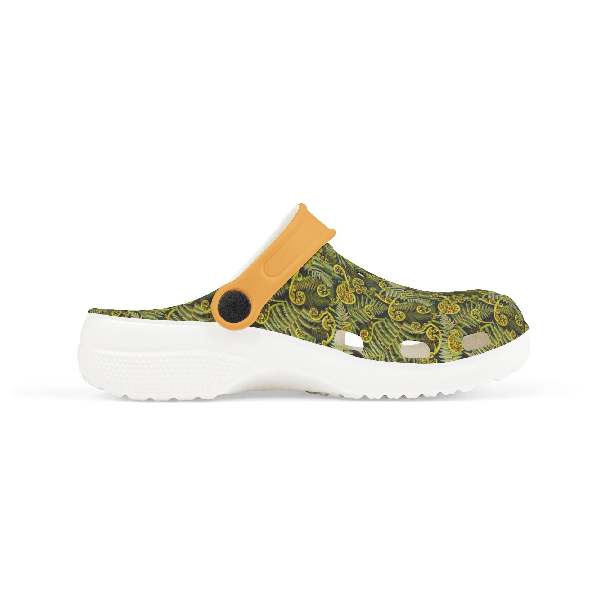 Side view of slip-on clogs with green patterned upper, tan strap, and white cushioned sole