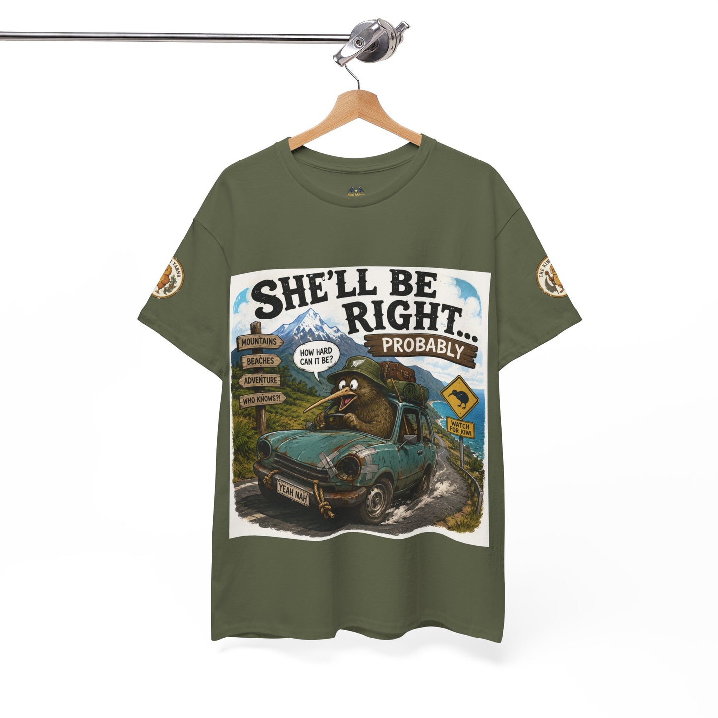 Dark green graphic T-shirt hanging on a hanger, with “She’ll Be Right… Probably” print.