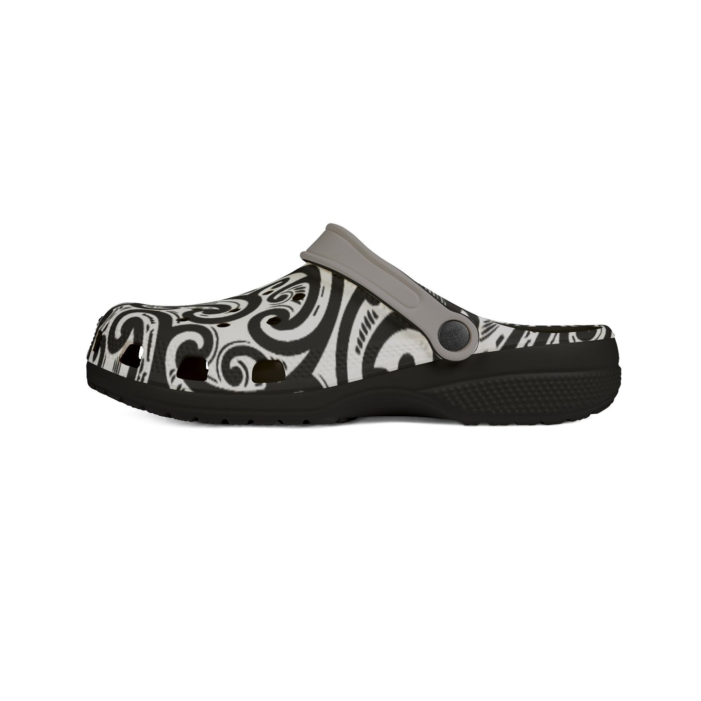 Croc-style clog with black-and-white patterned top strap and dark textured sole