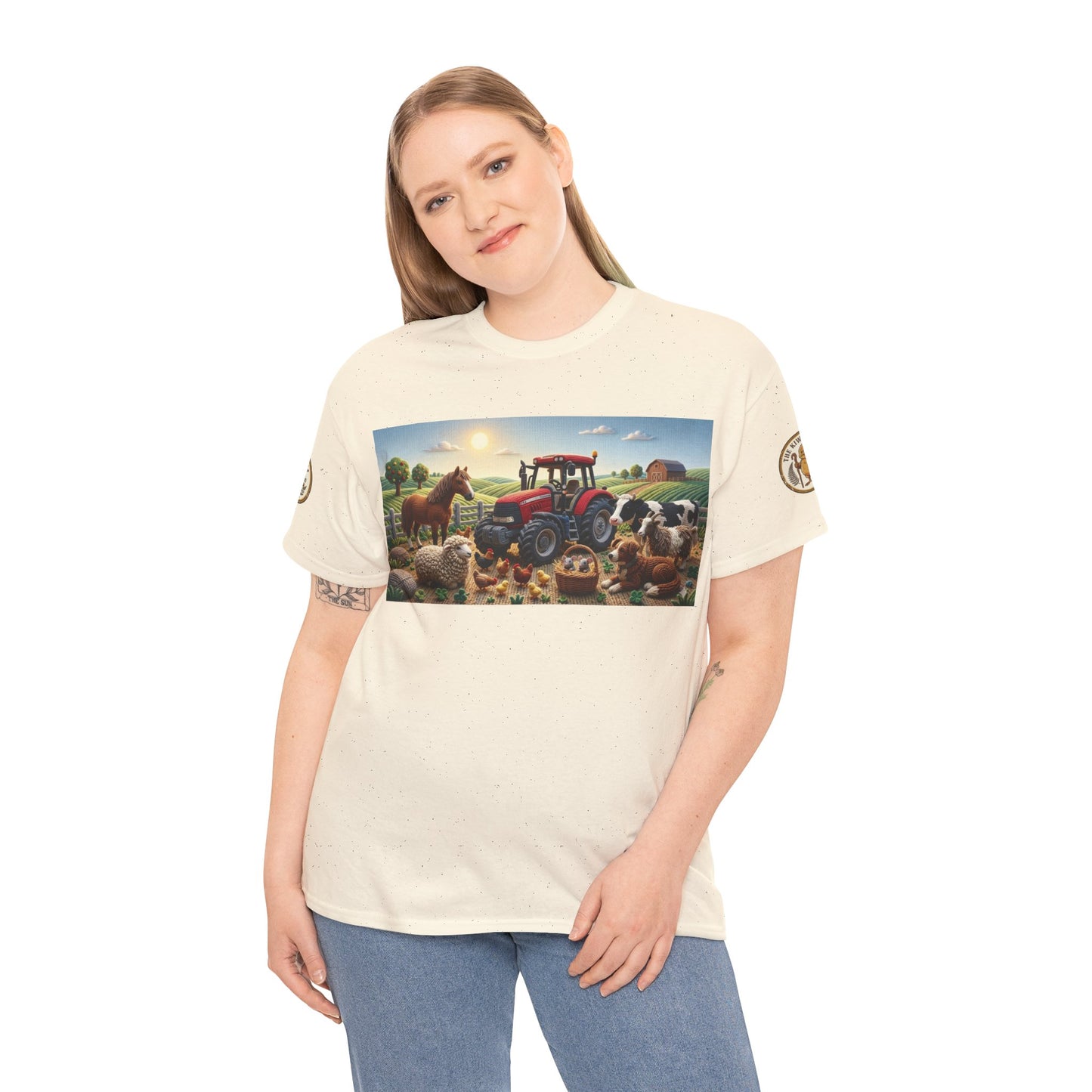 Cream graphic T-shirt on model, front farm scene print and small sleeve badge