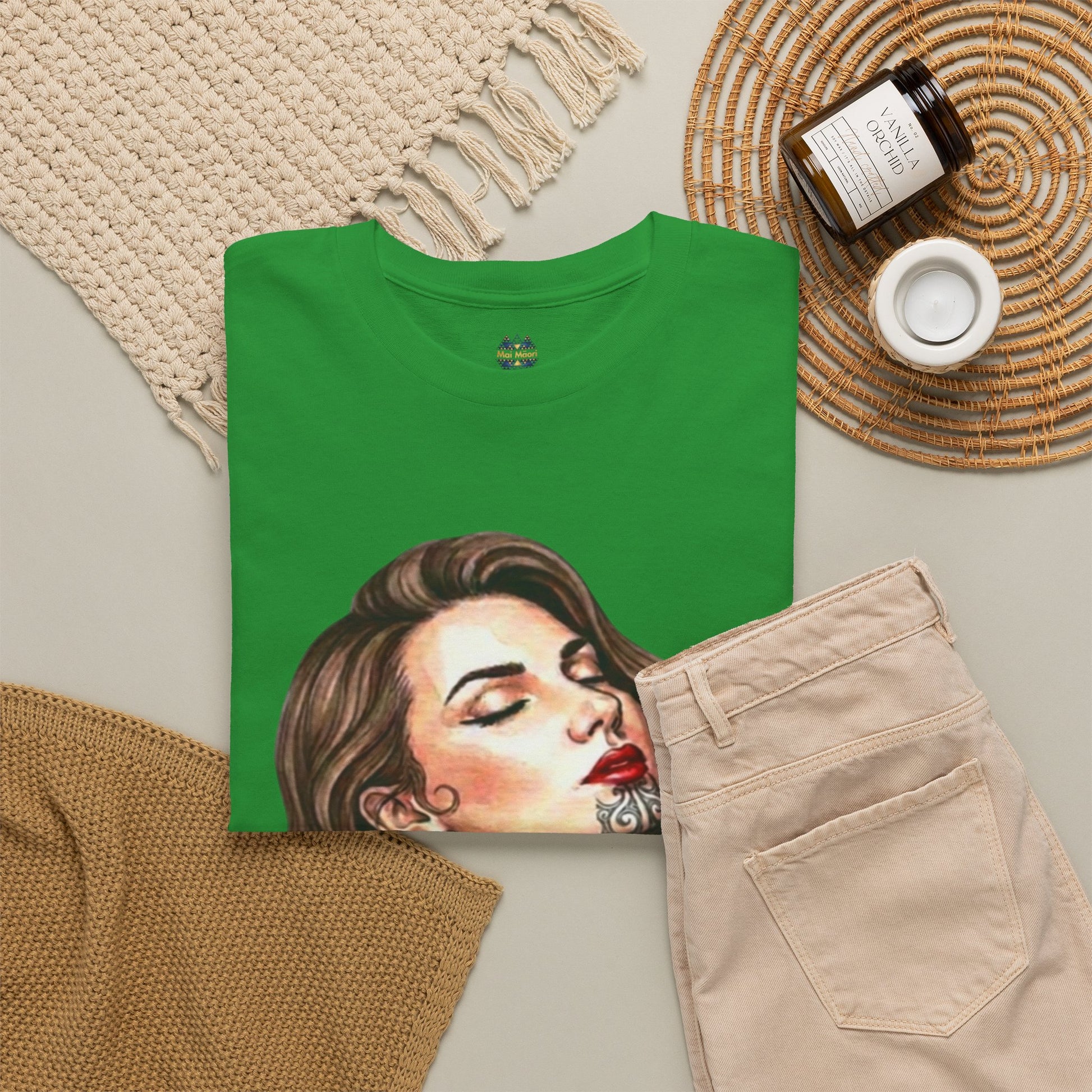 Green T-shirt with woman portrait print and small chest logo
