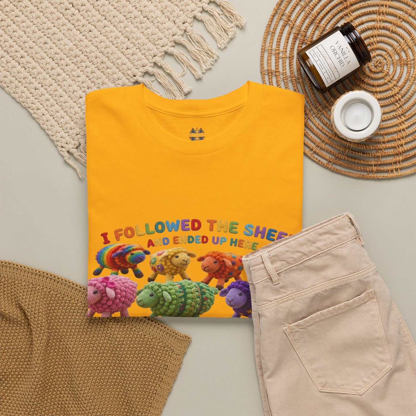Yellow crew-neck graphic T-shirt with colorful sheep crowd print and small sleeve badge