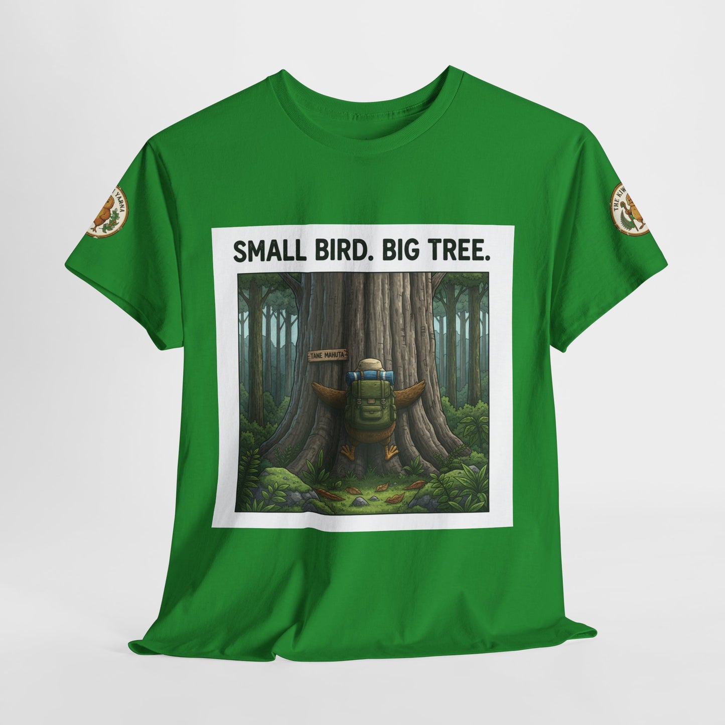 Green crew-neck T-shirt with centered white-framed forest scene and sleeve patches