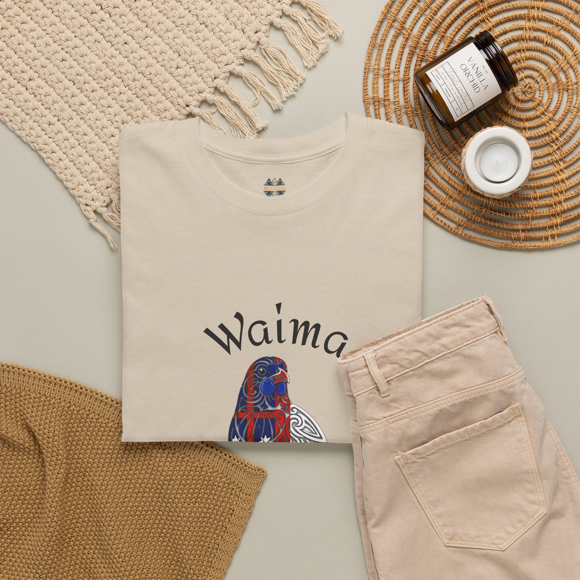 Folded beige T-shirt with Waima graphic print