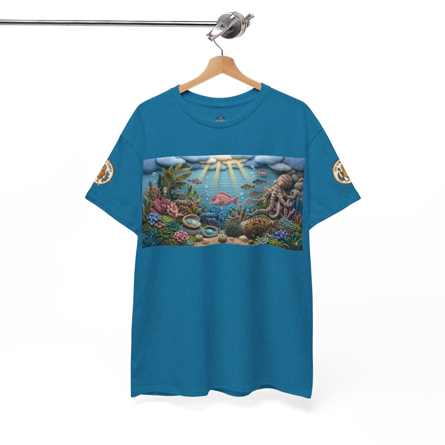 Teal/blue ocean graphic T-shirt hanging with coral reef chest print and sleeve patches