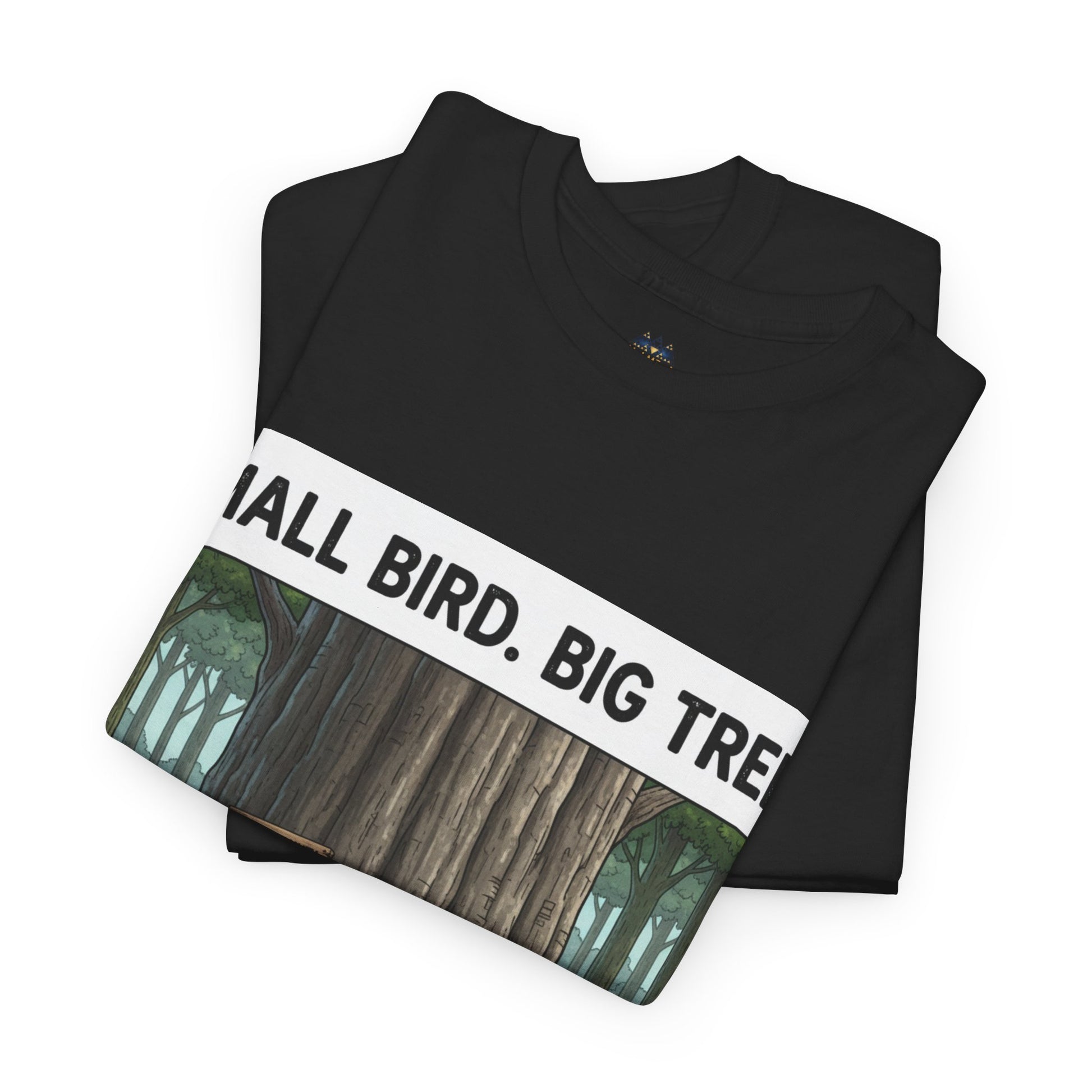 Black folded T-shirt showing “SMALL BIRD. BIG TREE.” graphic and forest scene panel