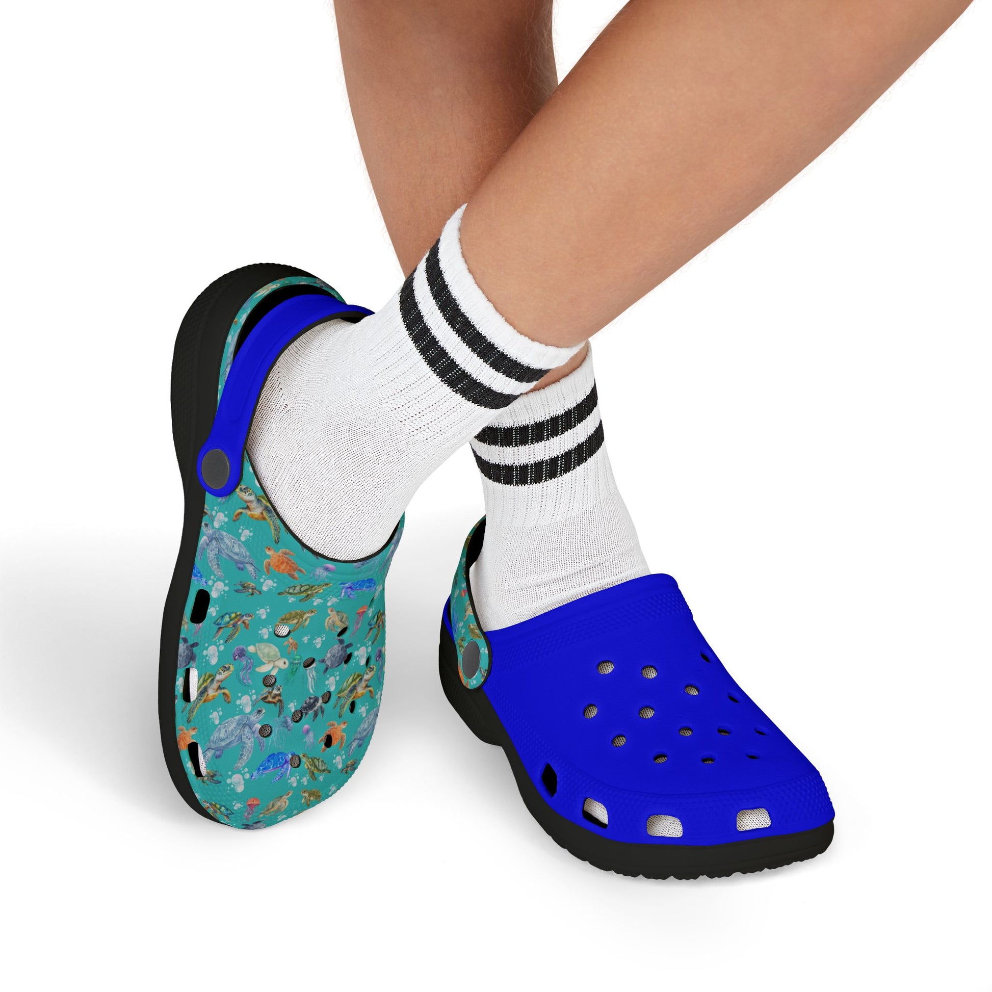 Kids' clogs with white socks; teal sea-animal print front, blue back, black sole.