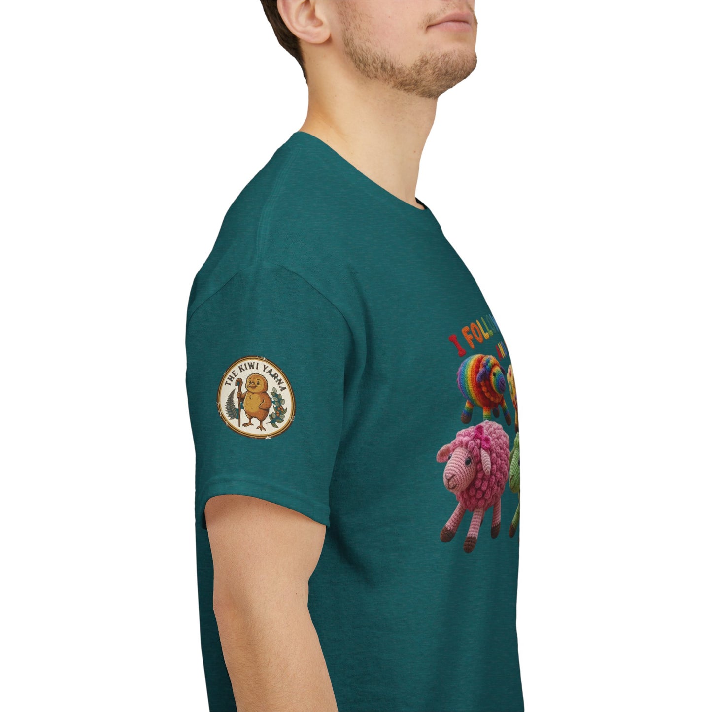 Teal crew-neck T-shirt with colorful sheep graphic and round sleeve logo patch